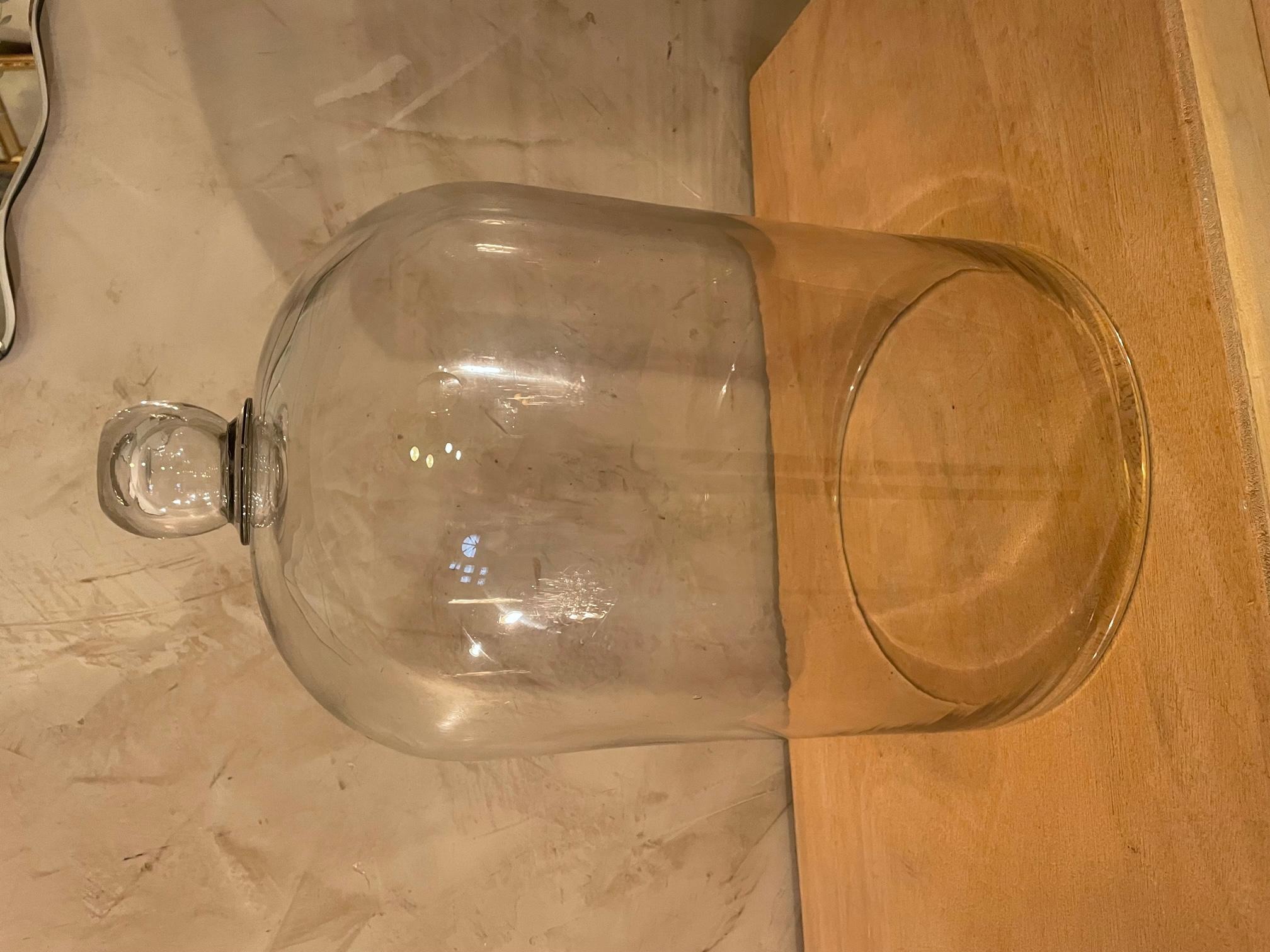 Very nice 20th century French blown glass bell from the 1900s. 
We can see the bubbles in the glass. Thick glass. 
On the top it has a glass sphere that allows you to raise the bell easily.
Very nice quality. Can be used as a decoration or to