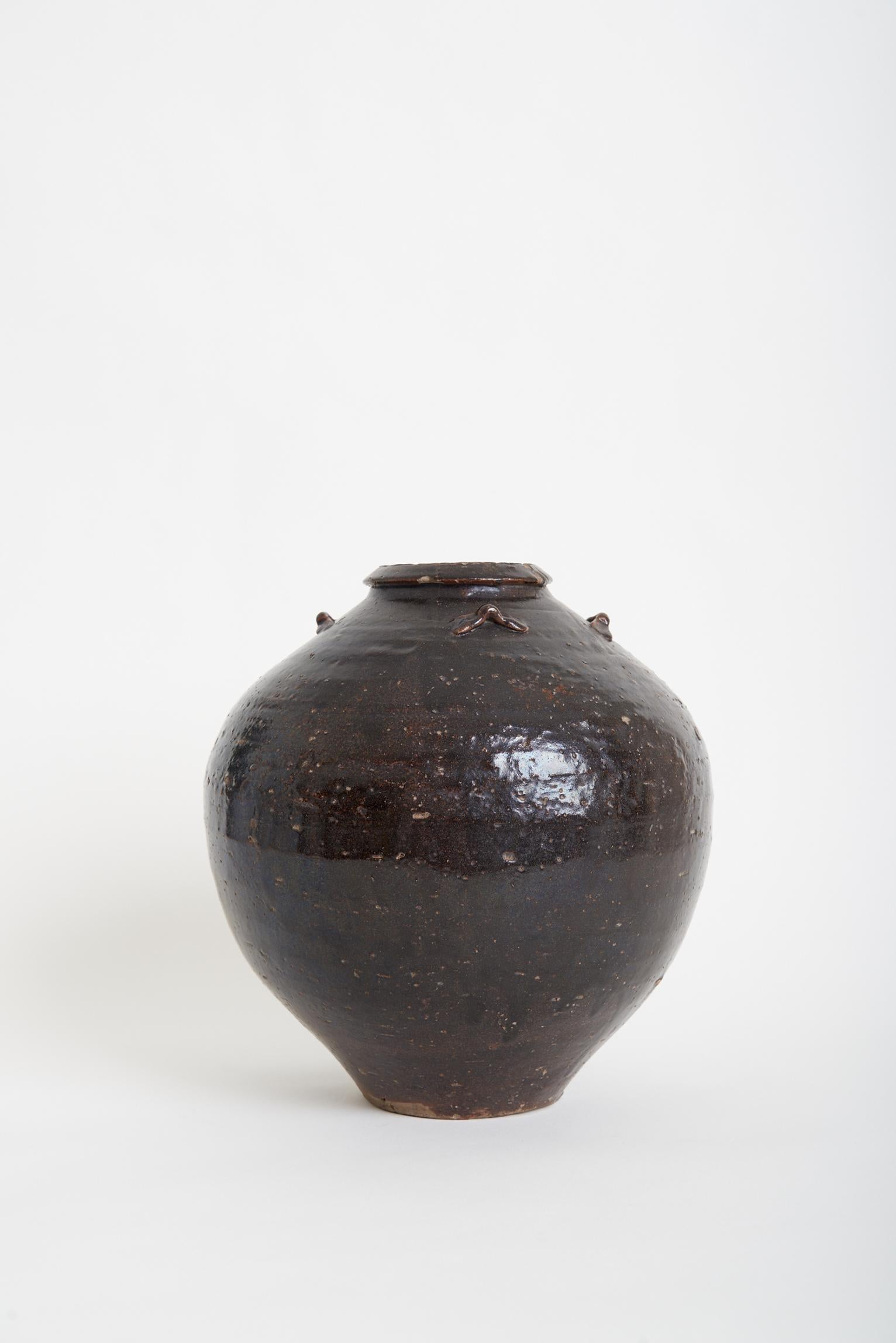 A large brown glazed ceramic vase.
South of France, early 20th century.