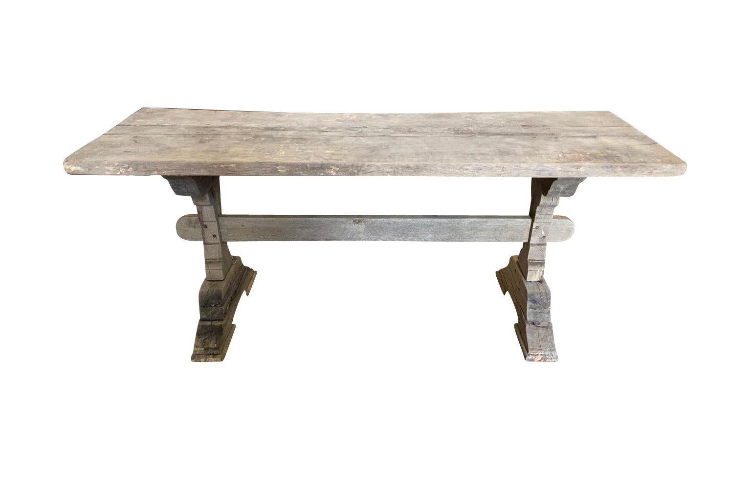 A very charming early 20th century Console Table - Trestle Table from the Provence region of France.  Soundly constructed from naturally washed beech wood.  Beautiful patina.