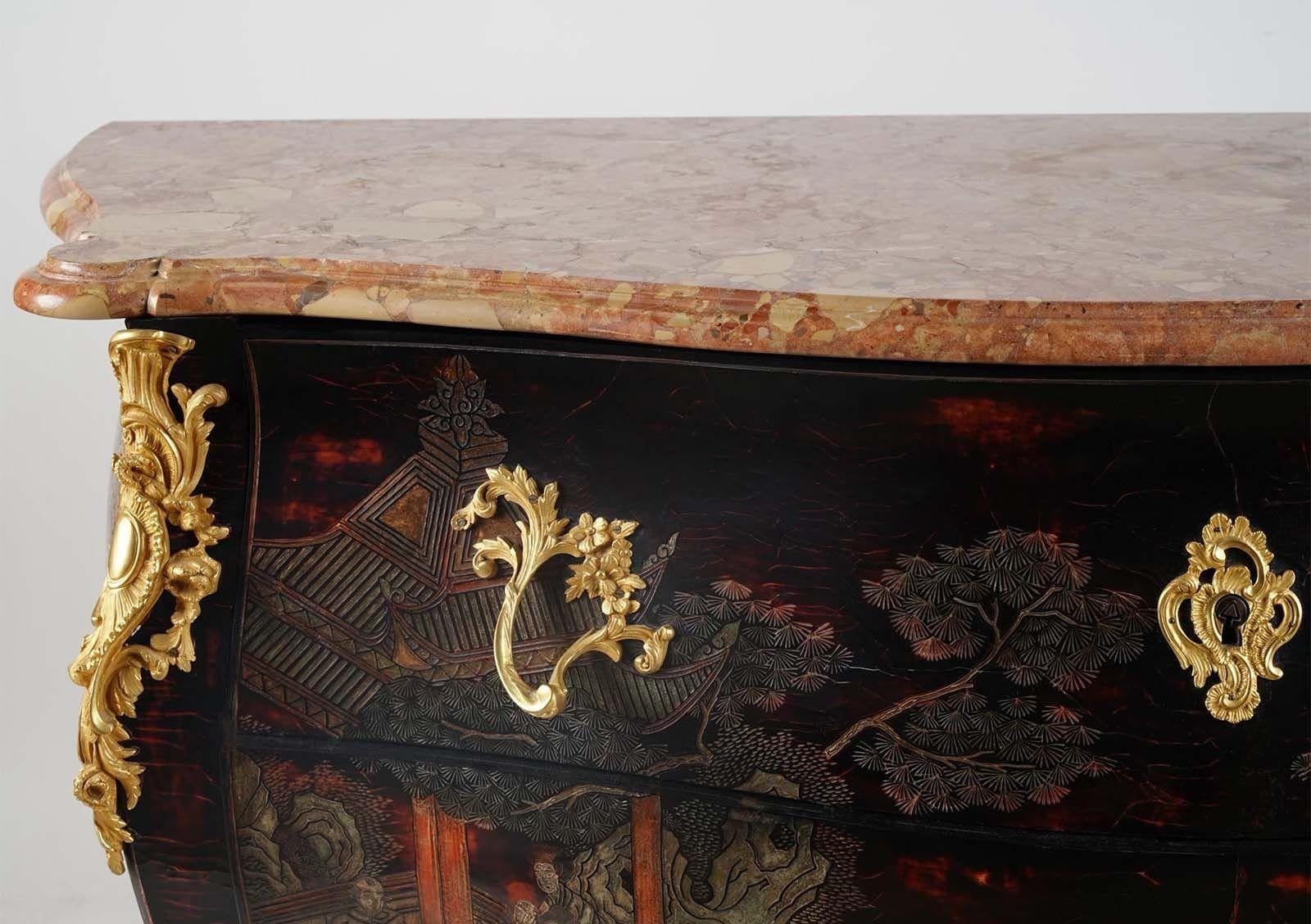 Traditional commode consisting of serpentine breche d'alep top over two drawers sans traverse; with coromandel-style decoration on front and side. Includes a gorgeous pink tone marble top as well. Gilt metal-mounted.
Dimensions:
35