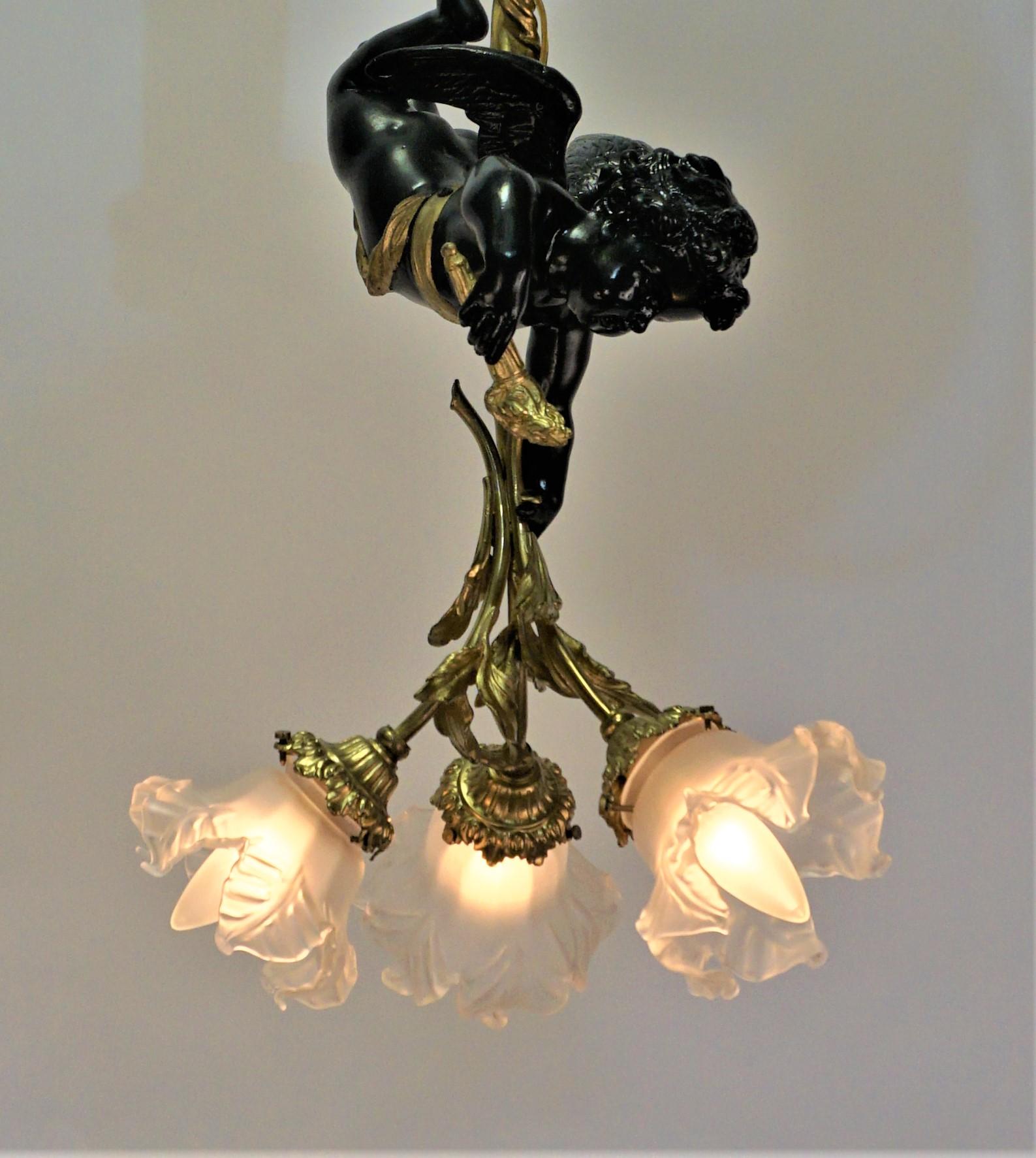 French early 20th century doré bronze three-light with blown glass shades chandelier.