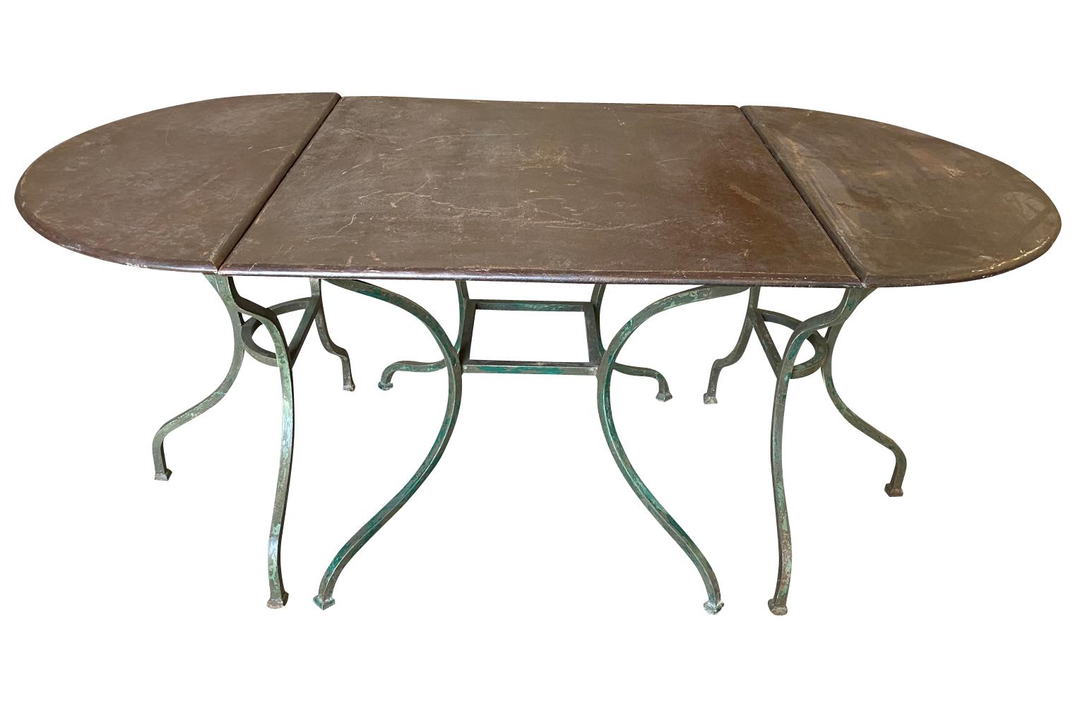 A delightful early 20th century Garden table set from the Provence region of France. Wonderfully presented in 3 sections including the center square table flanked by 2 demi lunes. Use together or separately. Soundly constructed from painted iron -