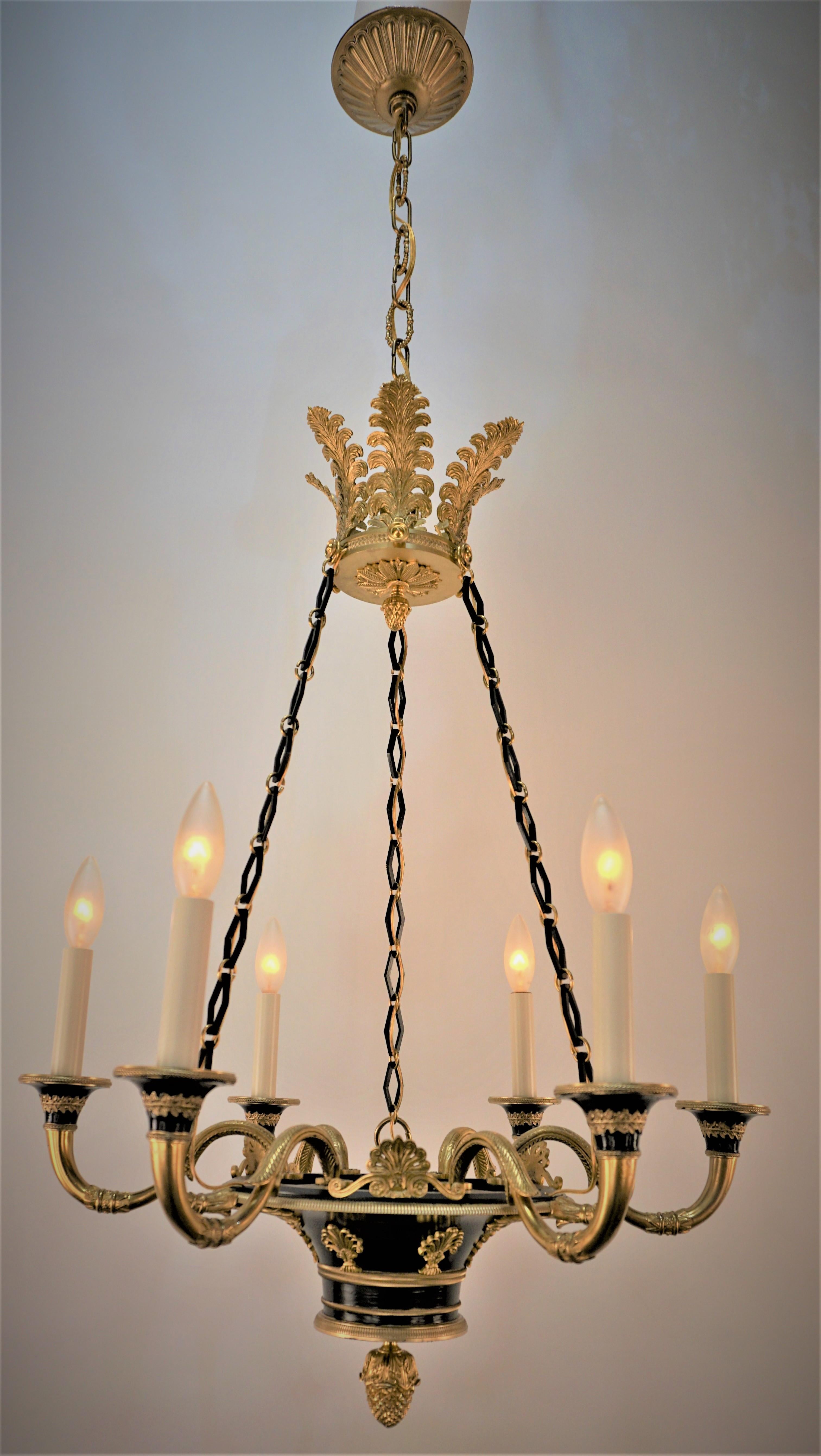 Elegant early 20th century six arm gilt bronze black lacquered empire chandelier.
Professionally rewired and ready for installation.
Height can be adjusted by removing some of the chain.