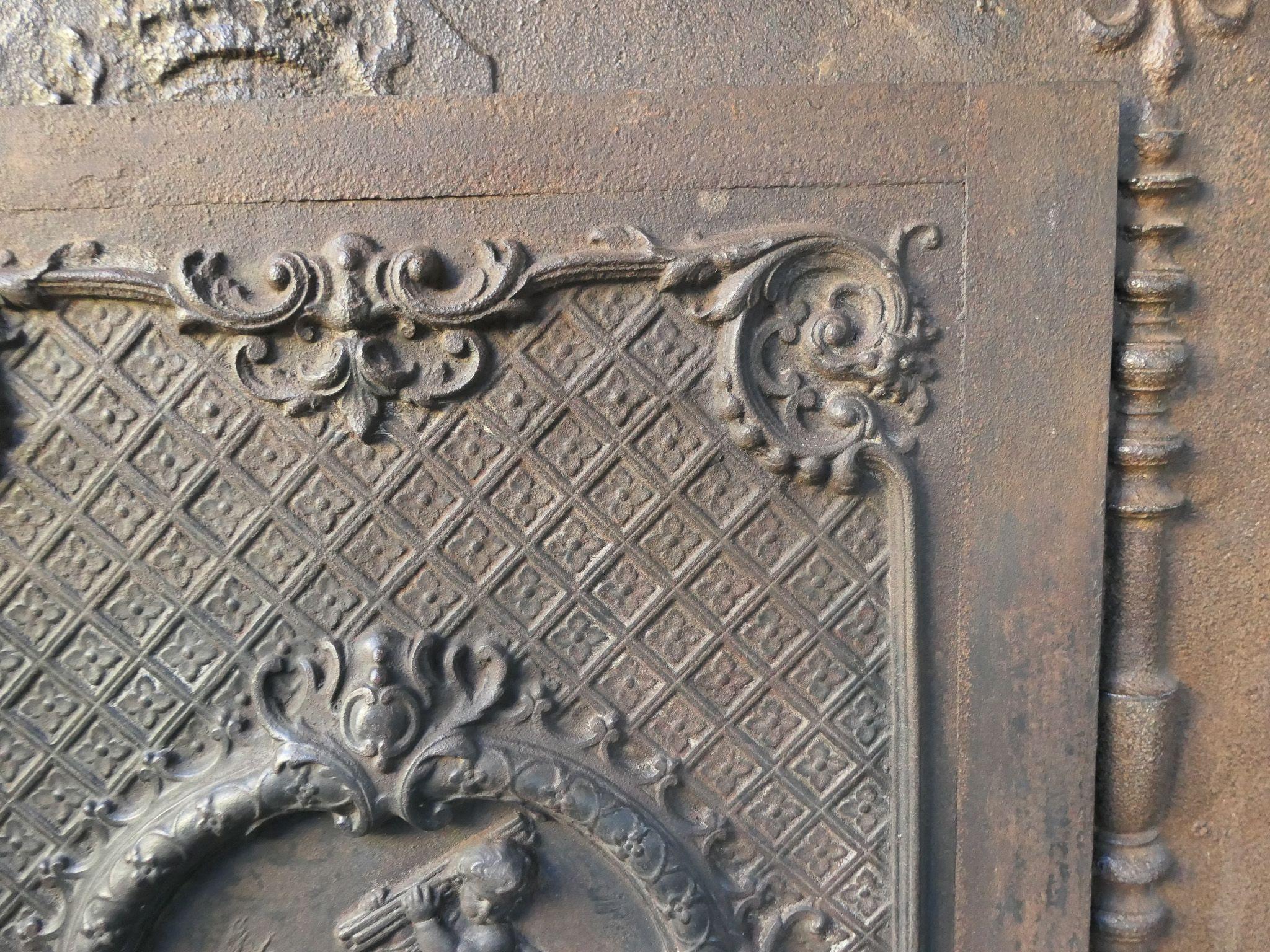 Iron French Early 20th Century Louis XV Style 'Cupids' Fireback / Backsplash. For Sale