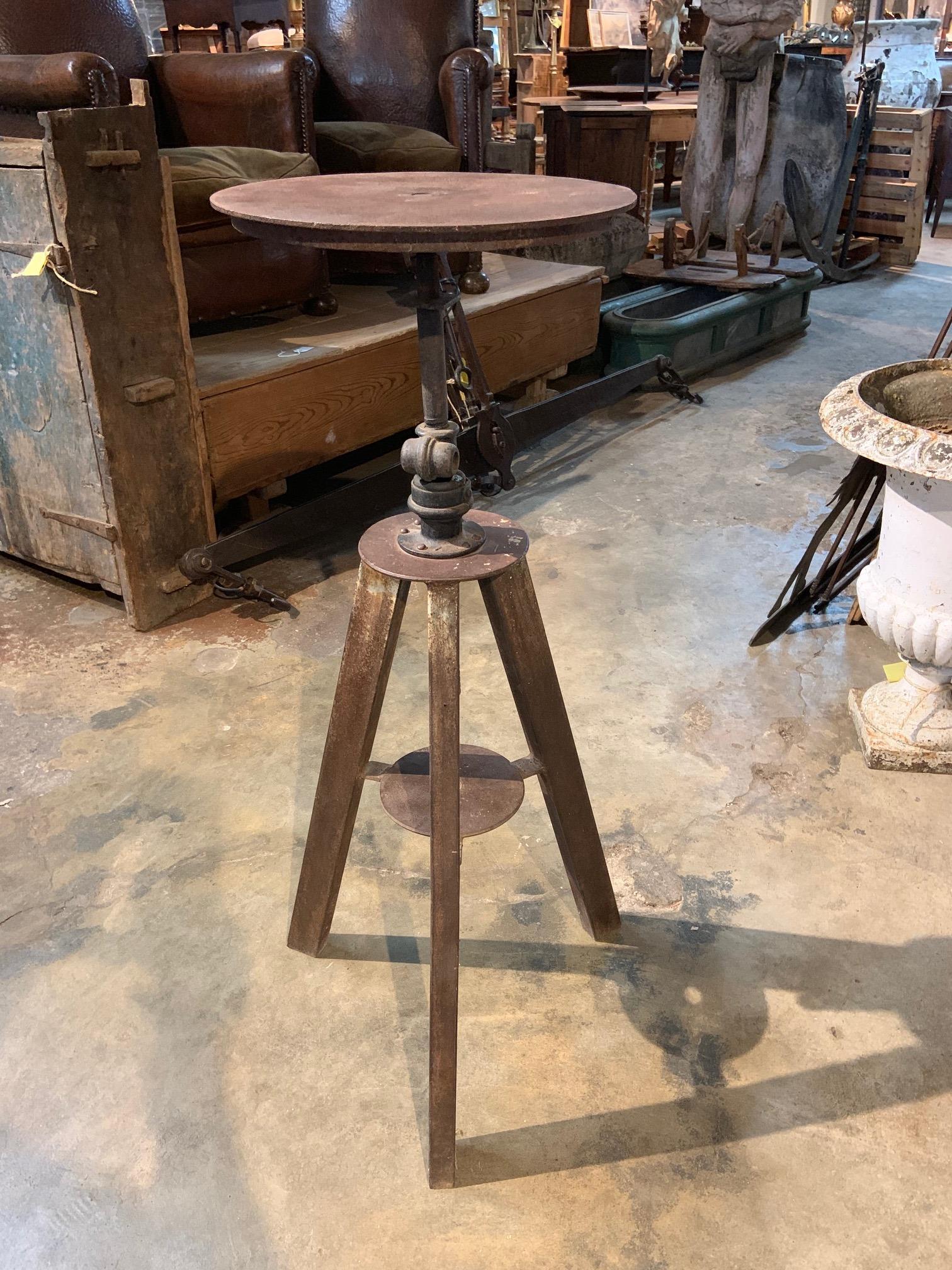 A terrific early 20th century industrial Selette - Sculptor's stand from the South of France. Sturdily constructed from iron with a great patina. Wonderful for the display of artwork. The footprint measures 17