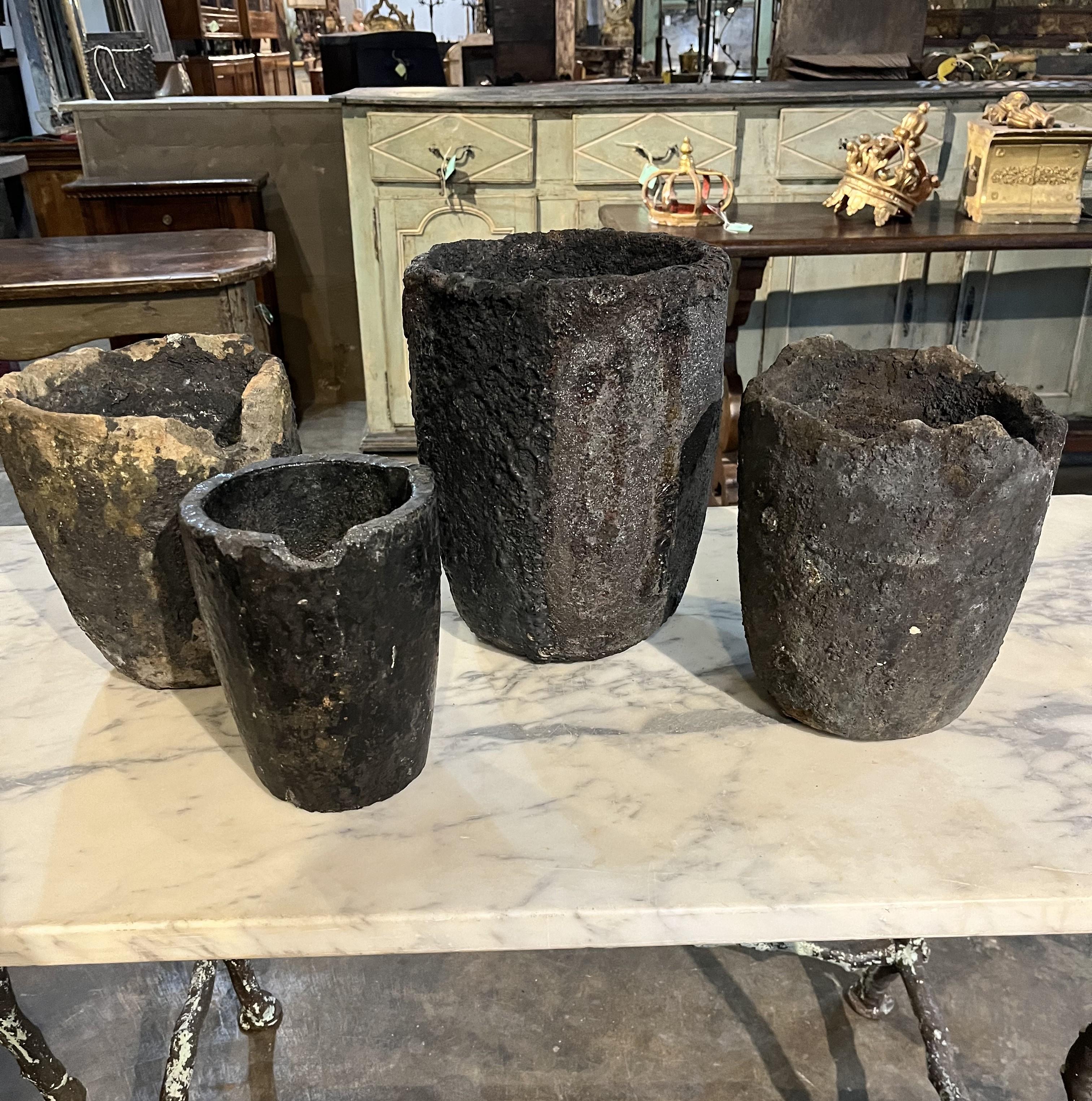 A terrific set of 4 early 20th century Creuzet - foundry Pots from France of unusually small scale. Fabulous patina. Fabulous as jardinieres or planters. Perfect for any interior of garden. A Crucible was made from a lava-like material with a much