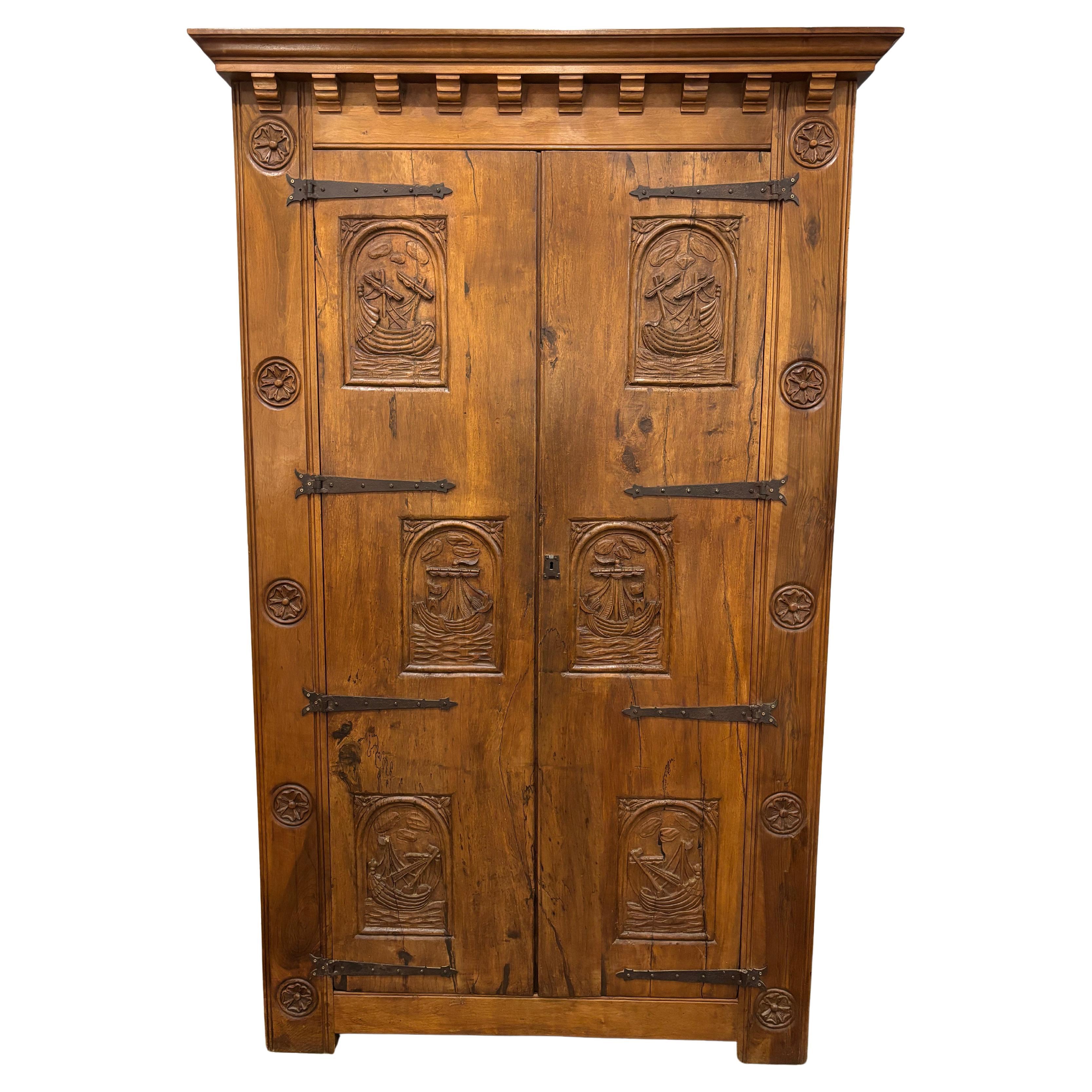 This amazing armoire is in walnut and carved in the wood of sailors ships in a different situation.
It probably comes from the port of Britany France where the sailors were very active.
