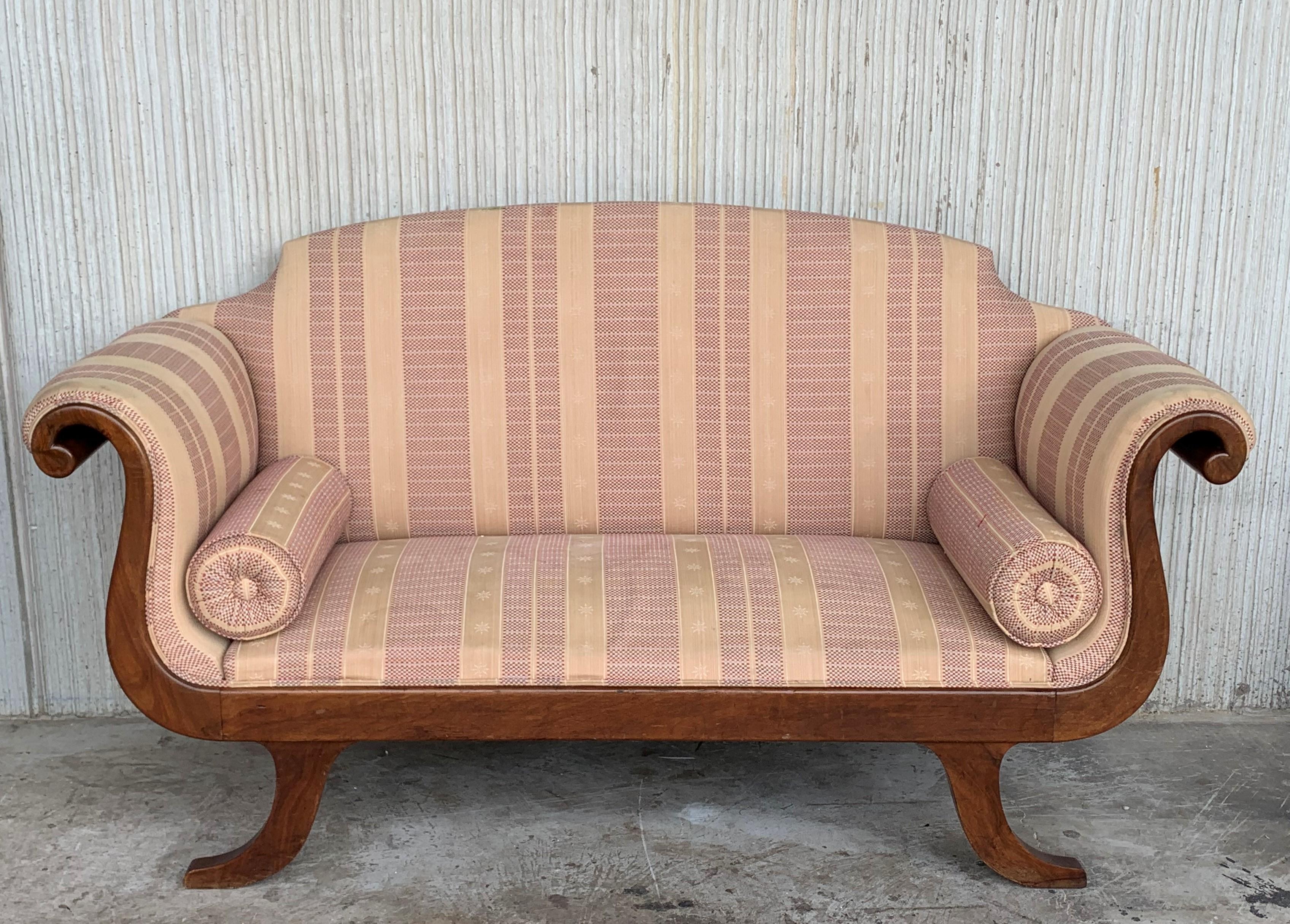old style couch with wooden arms