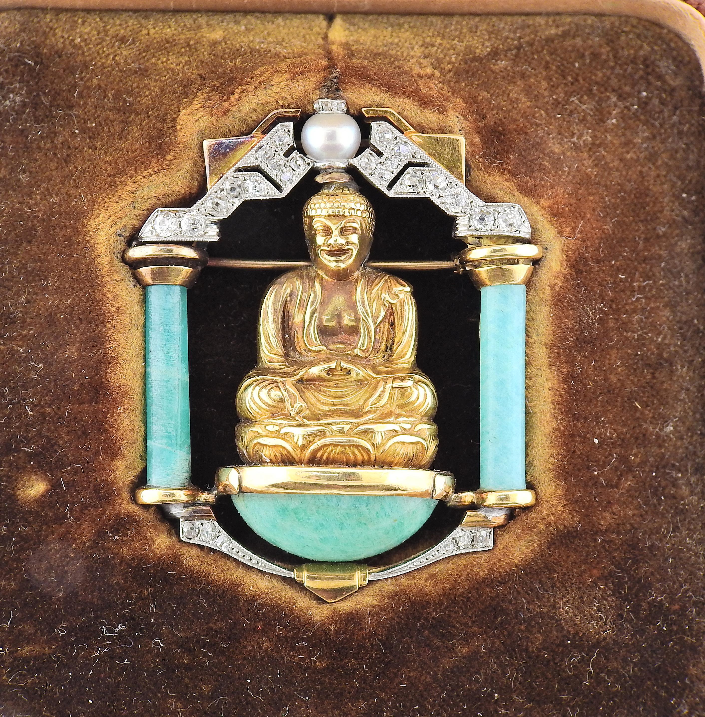 French made early Art Deco brooch, set in 18k gold and platinum, depicting Buddha, adorned with old mine cut diamonds, pearl and jade. Brooch measures 1 6/8