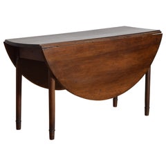 French Early Neoclassic Walnut Circular Gateleg Table, early 19th century