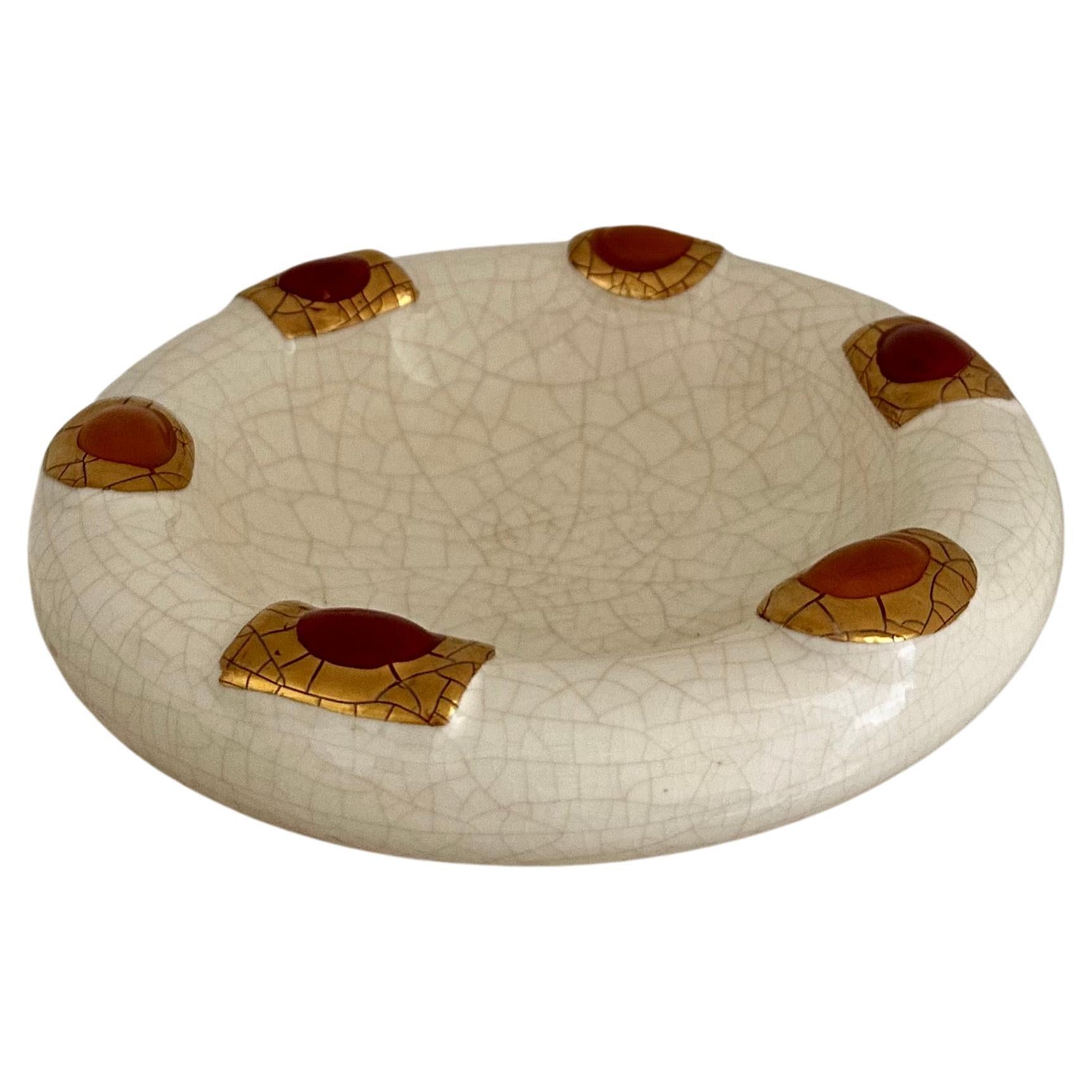 Vintage Longwy art deco style earthenware bowl decorated with cream crackled glaze and enamelled yellow and red cabochons encircled with gold. A beautiful and rare modernist dish by Faienceries de Longwy Depuis, France. Most likely produced in the