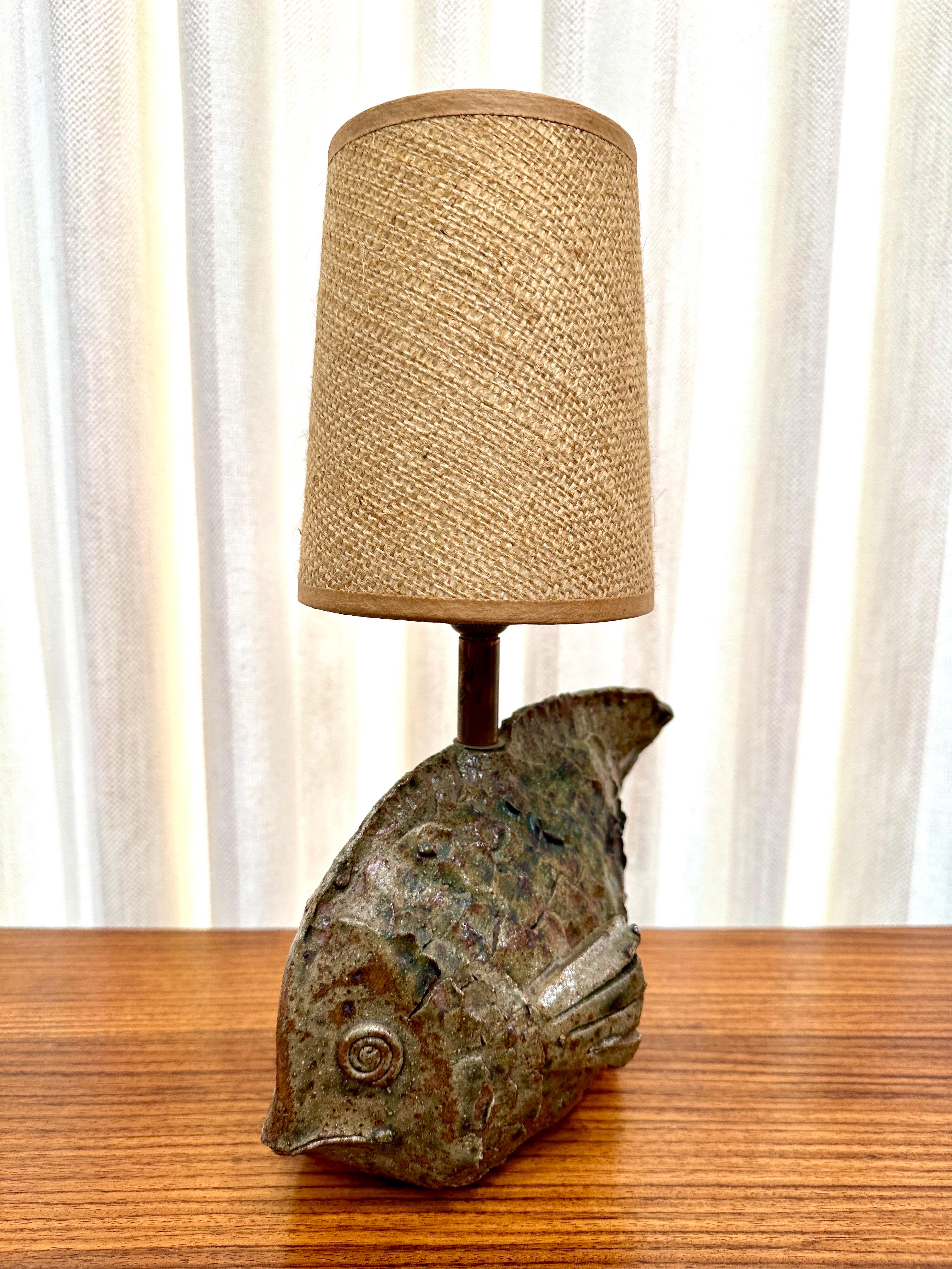 This petite and charming hand made earthenware fish design lamp has TONS of character and beautiful coloring.  See all images and video.  THIS ITEM IS LOCATED AND WILL SHIP FROM OUR MIAMI, FLORIDA SHOWROOM.