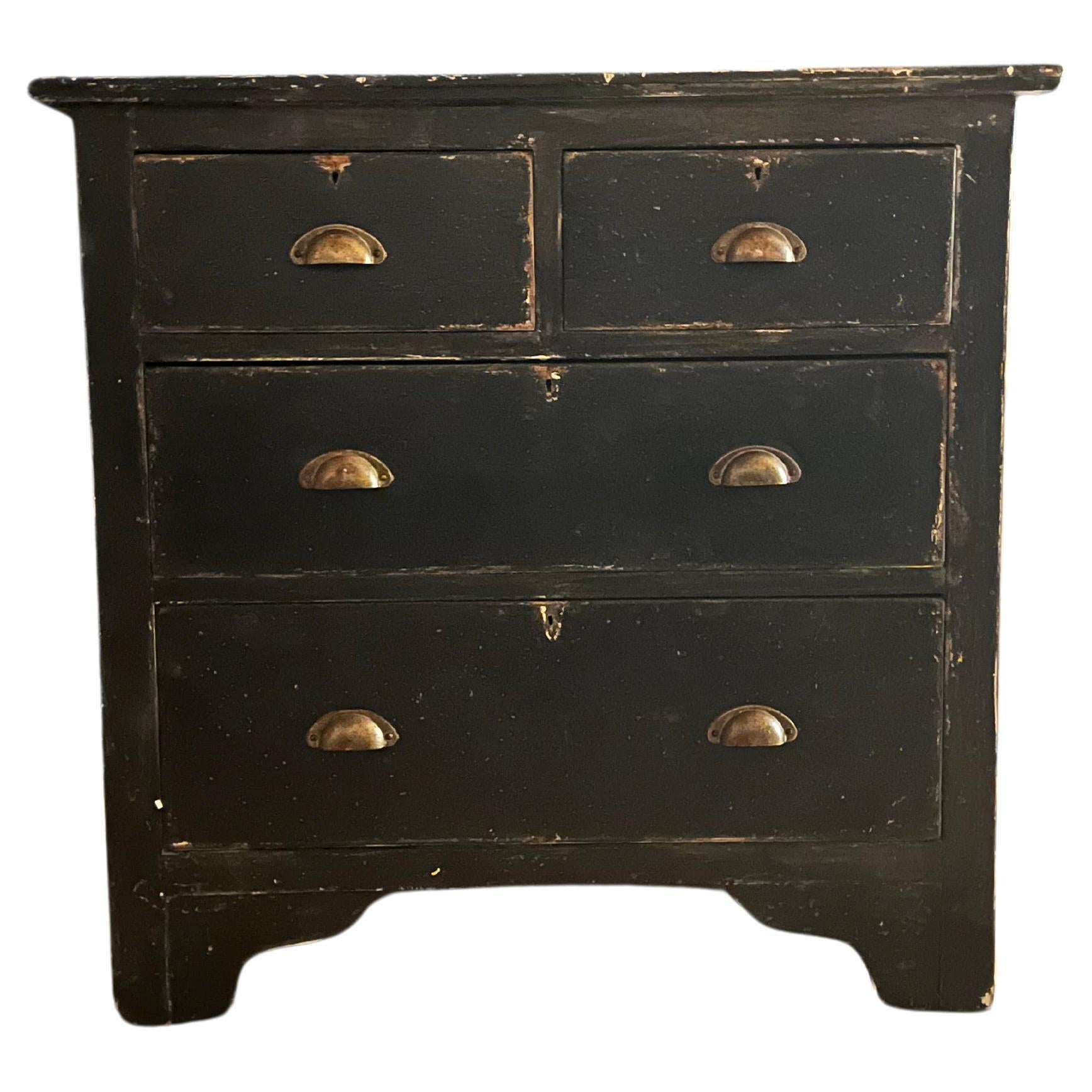 This French ebonised distressed Pine chest of drawers/dresser, is a stunning piece of Vintage furniture from the 1930s. This piece was sourced in Le Harve France, the ebonised finish adds a touch of sophistication to the distressed pine, creating a