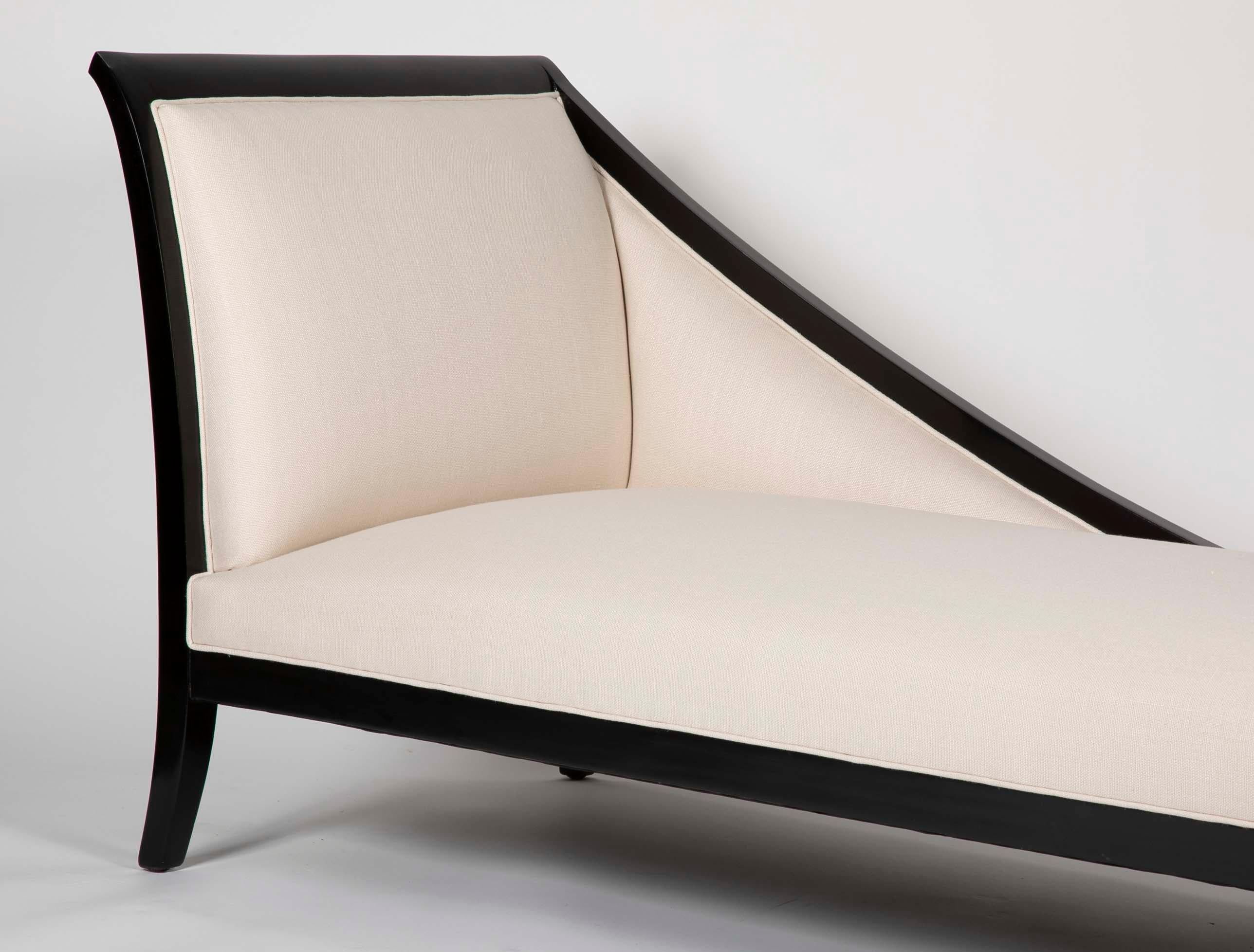 A French ebonized daybed newly upholstered in Belgian linen. Designed in the style of Andre Arbus.