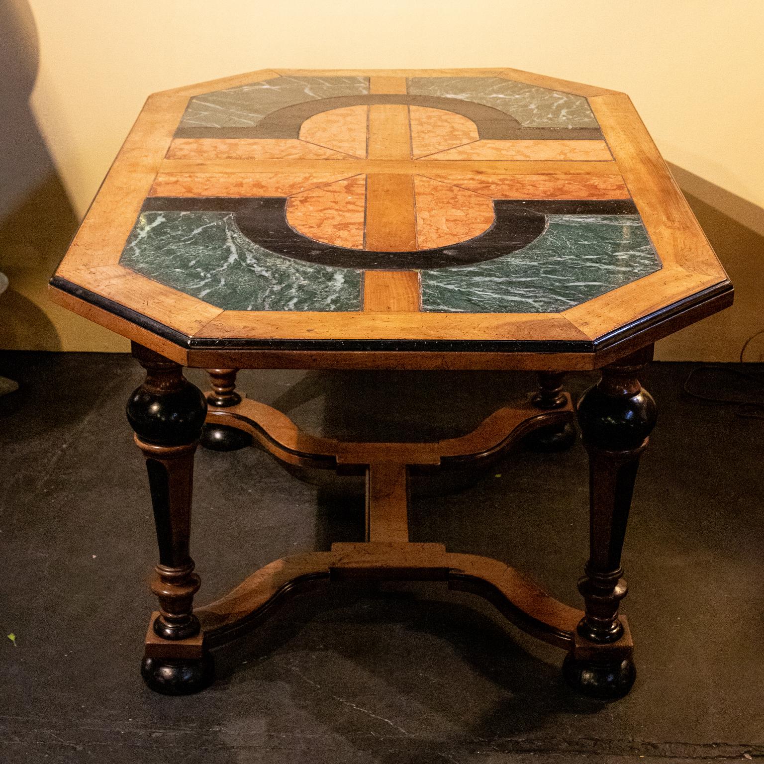 French center table or desk in walnut with ebonized legs on bun feet and inlaid marble top, circa 19th century. Please note of wear consistent with age including minor nicks. Made in France.