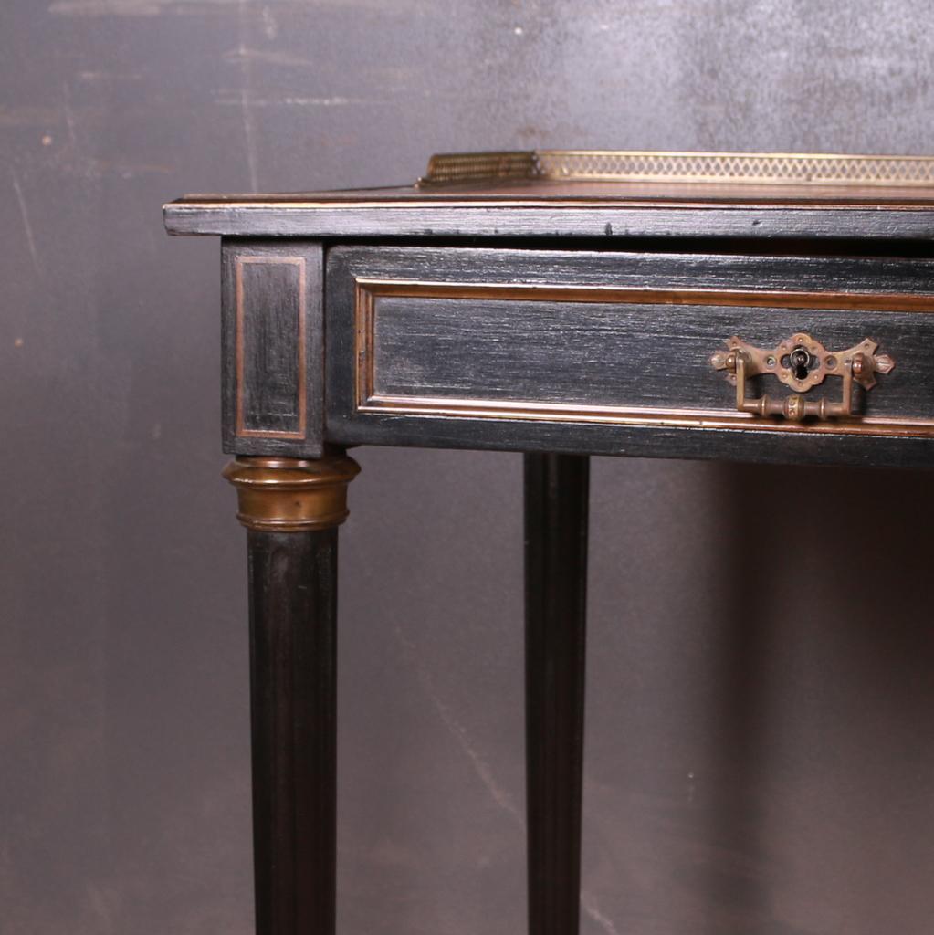 Smart 19th C French ebonized wood and brass writing table. 1890.

25.5