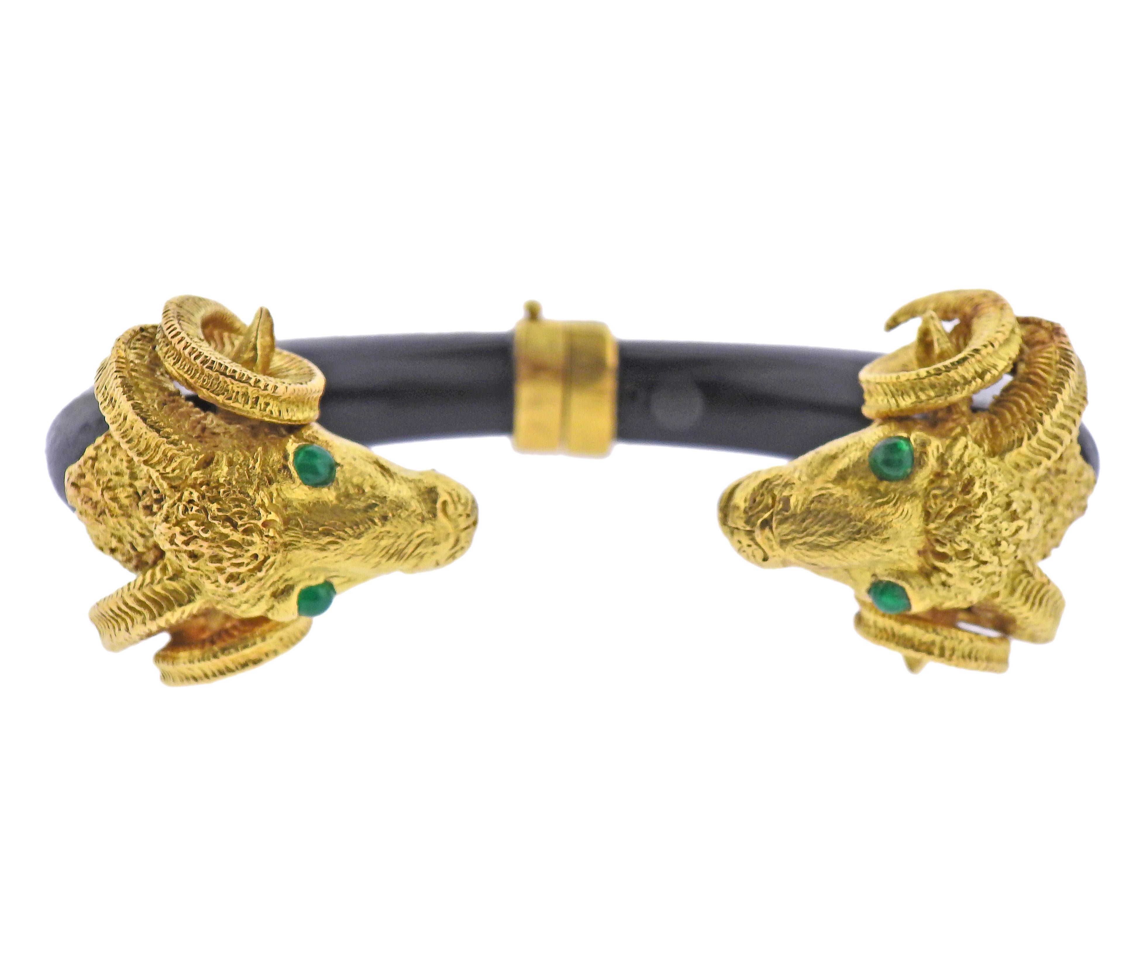 French made 18k gold ram's head bracelet, with ebony wood and emerald eyes. Bracelet will fit up to a 7.5