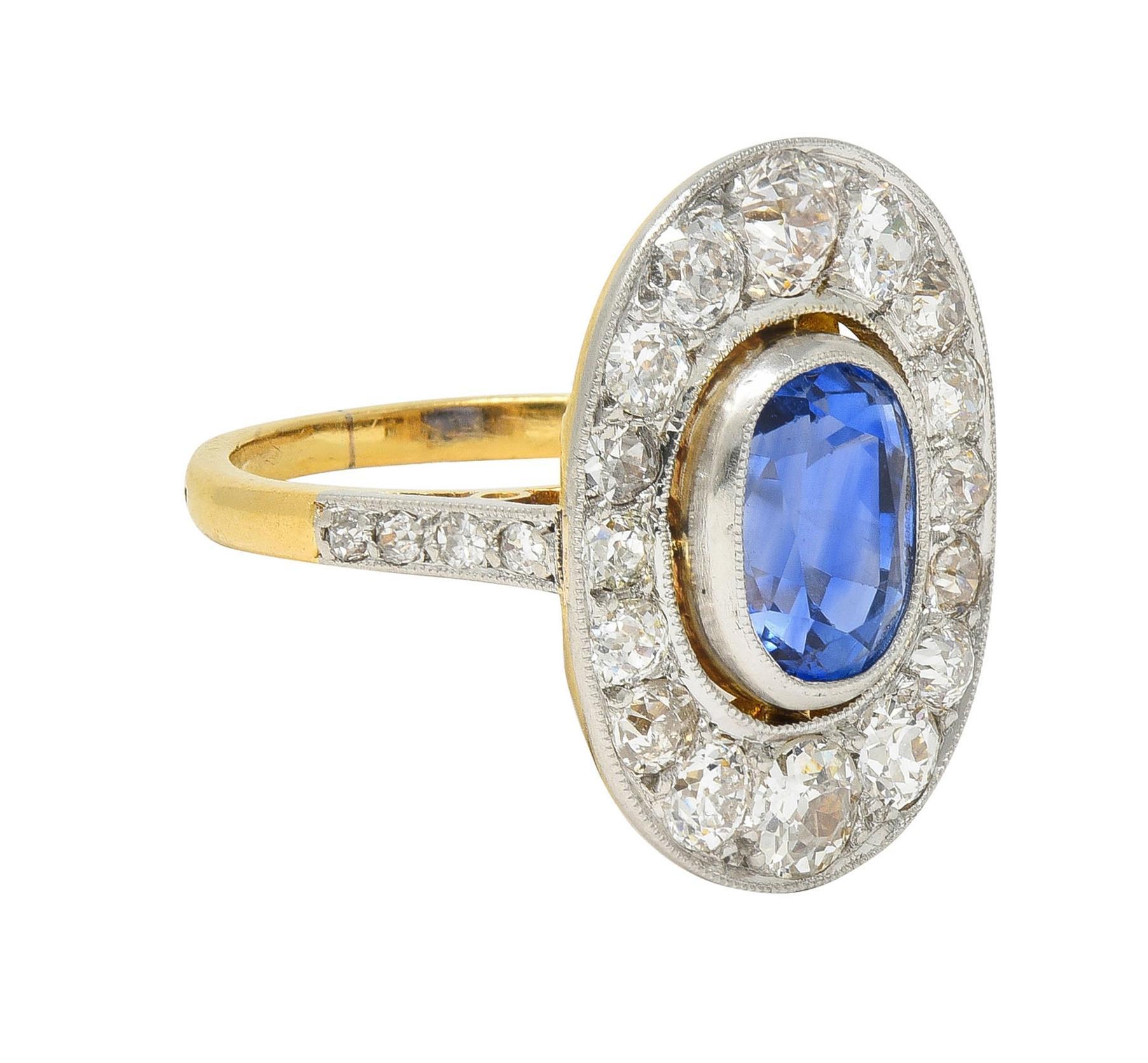 Centering an elongated cushion cut sapphire weighing 2.64 carats total - transparent medium blue
Natural Sri Lanka in origin and displaying no indications of heat treatment
Set in a platinum-topped milgrain bezel with a pierced floating halo