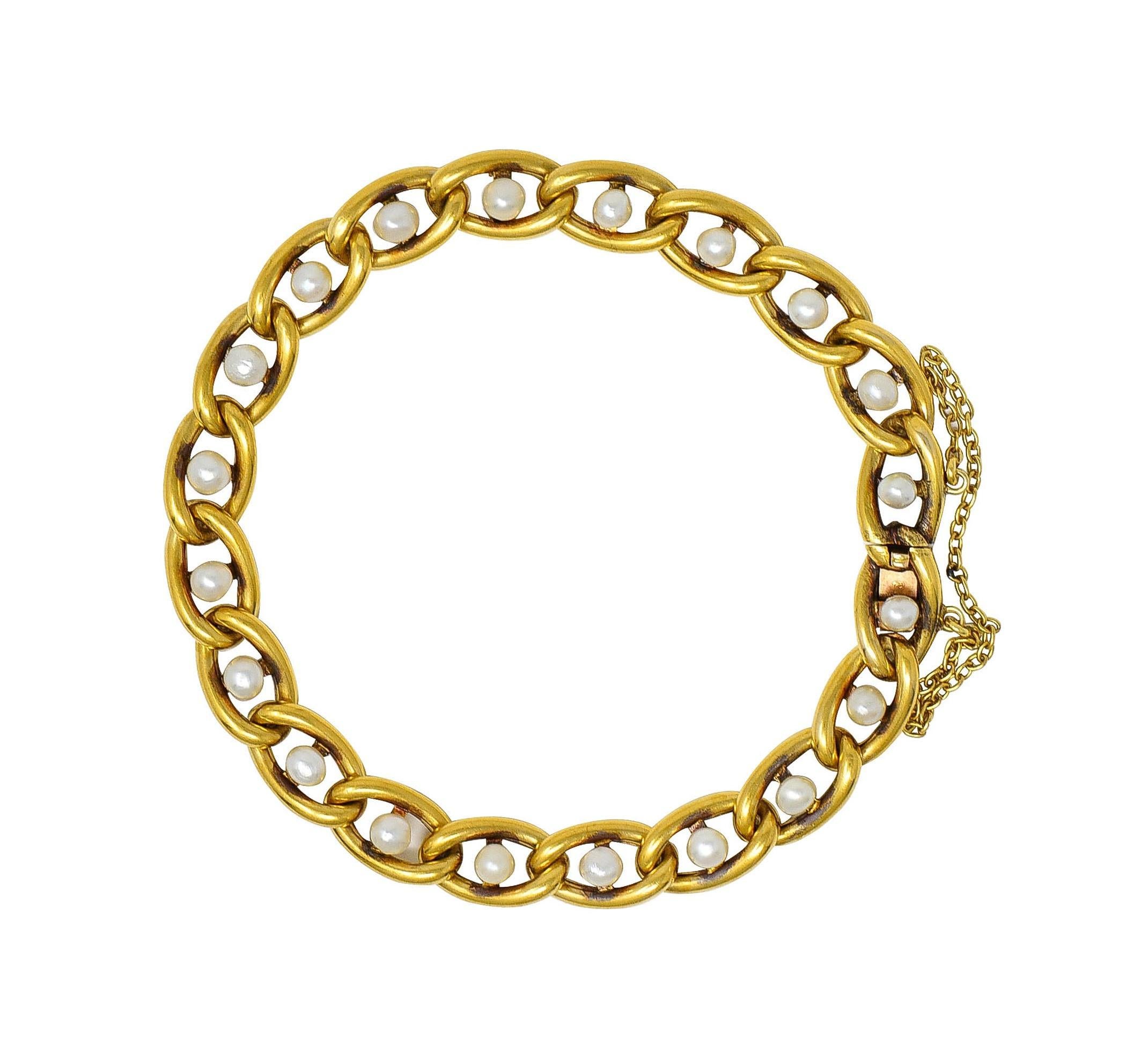 Designed as a gold curb link chain bracelet 
Accented by 3.0 mm round pearls 
Cream with strong iridescence
Mounted on each link
Completed by concealed clasp closure
With hinged figure eight safety 
Stamped with French hallmarks for 18 karat