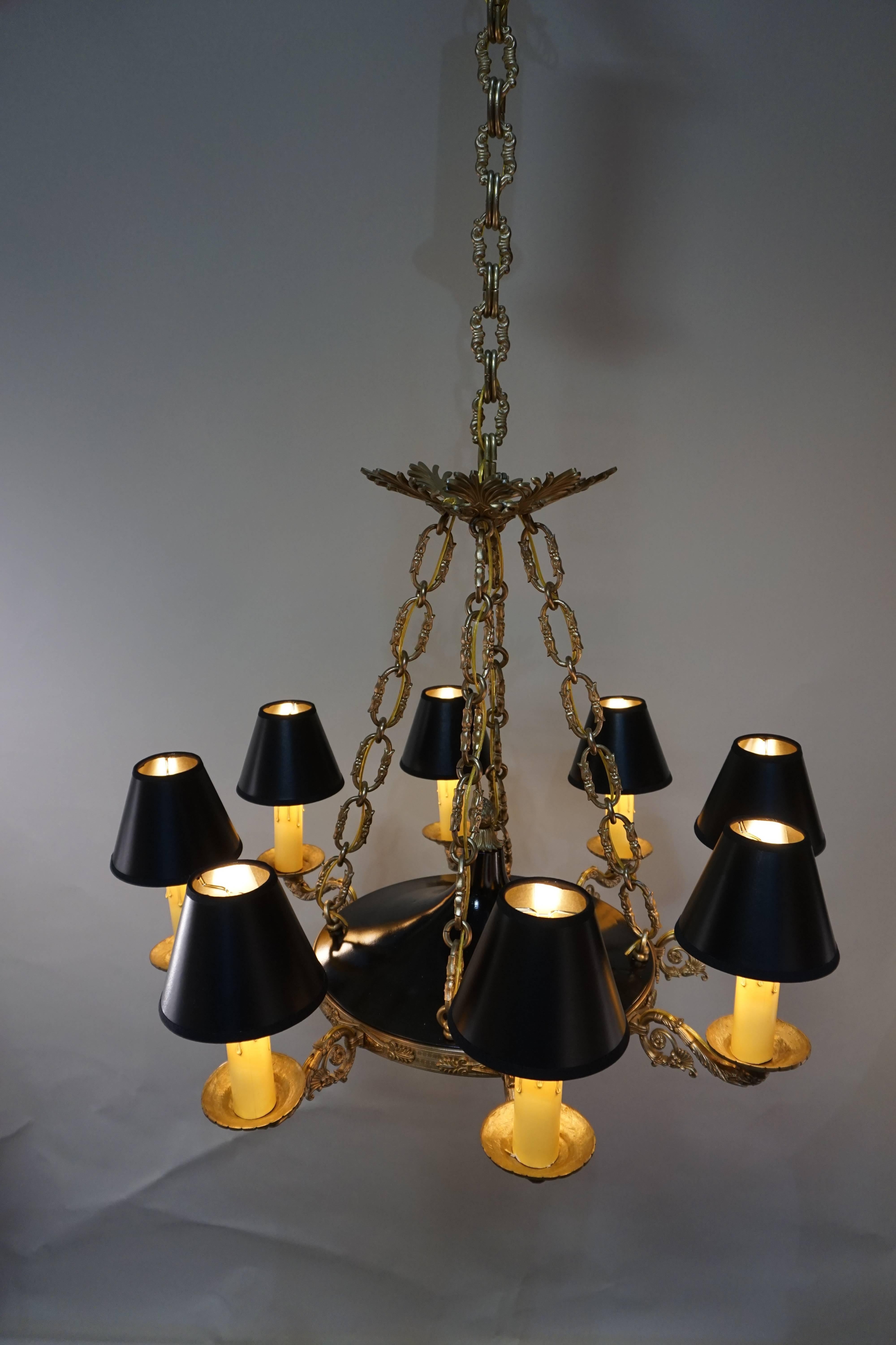 Made in France during 1930s. A truly beautiful eight-light French Empire bronze chandelier.
This chandelier can be fully installed with 28