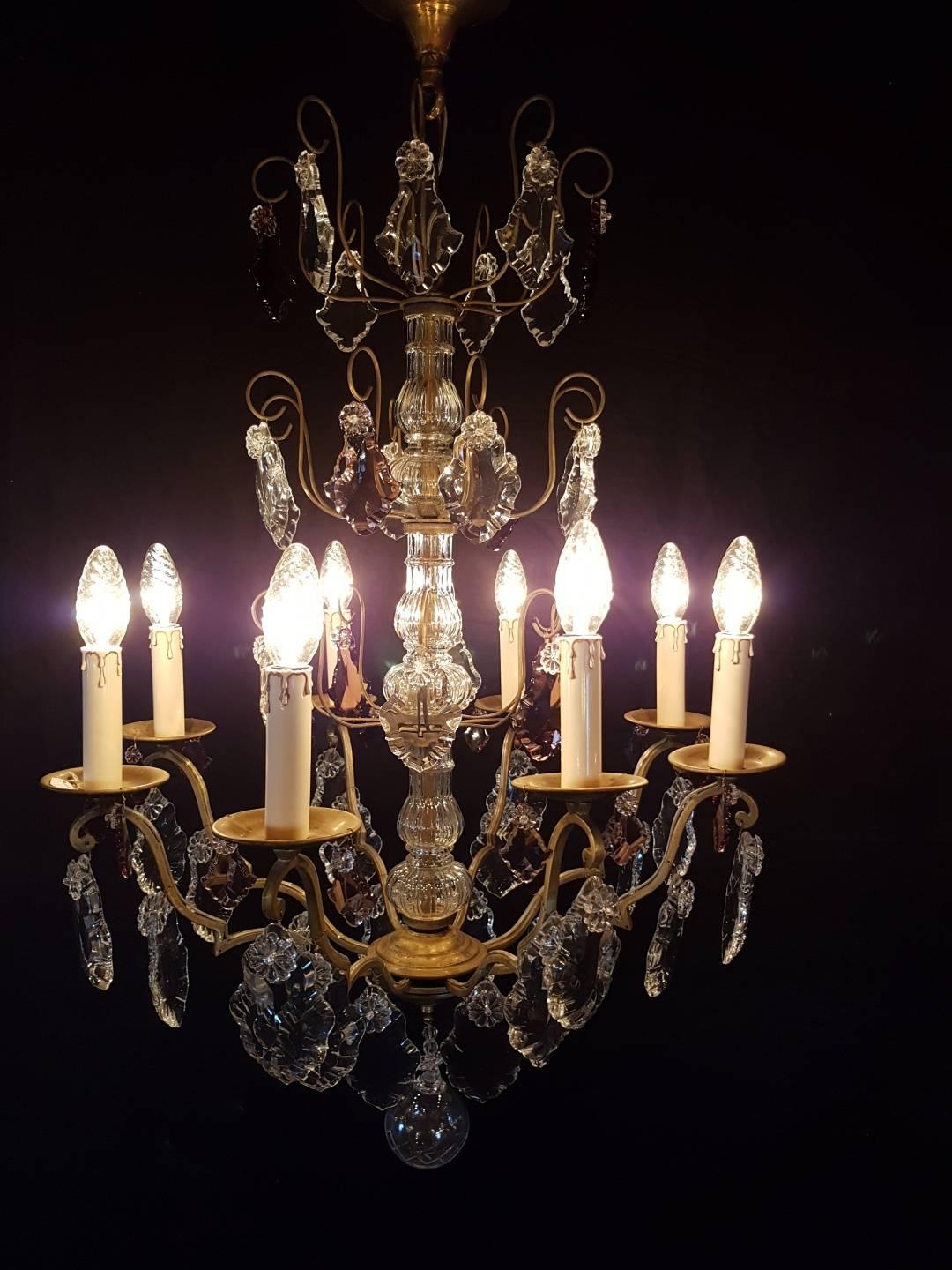 French chandelier with eight candle lights with 3 clear and purple crystals

This is just one of our large collection chandeliers. Besides the old and antique chandeliers we have beautiful series of new large chandeliers in the Marie Therese style.