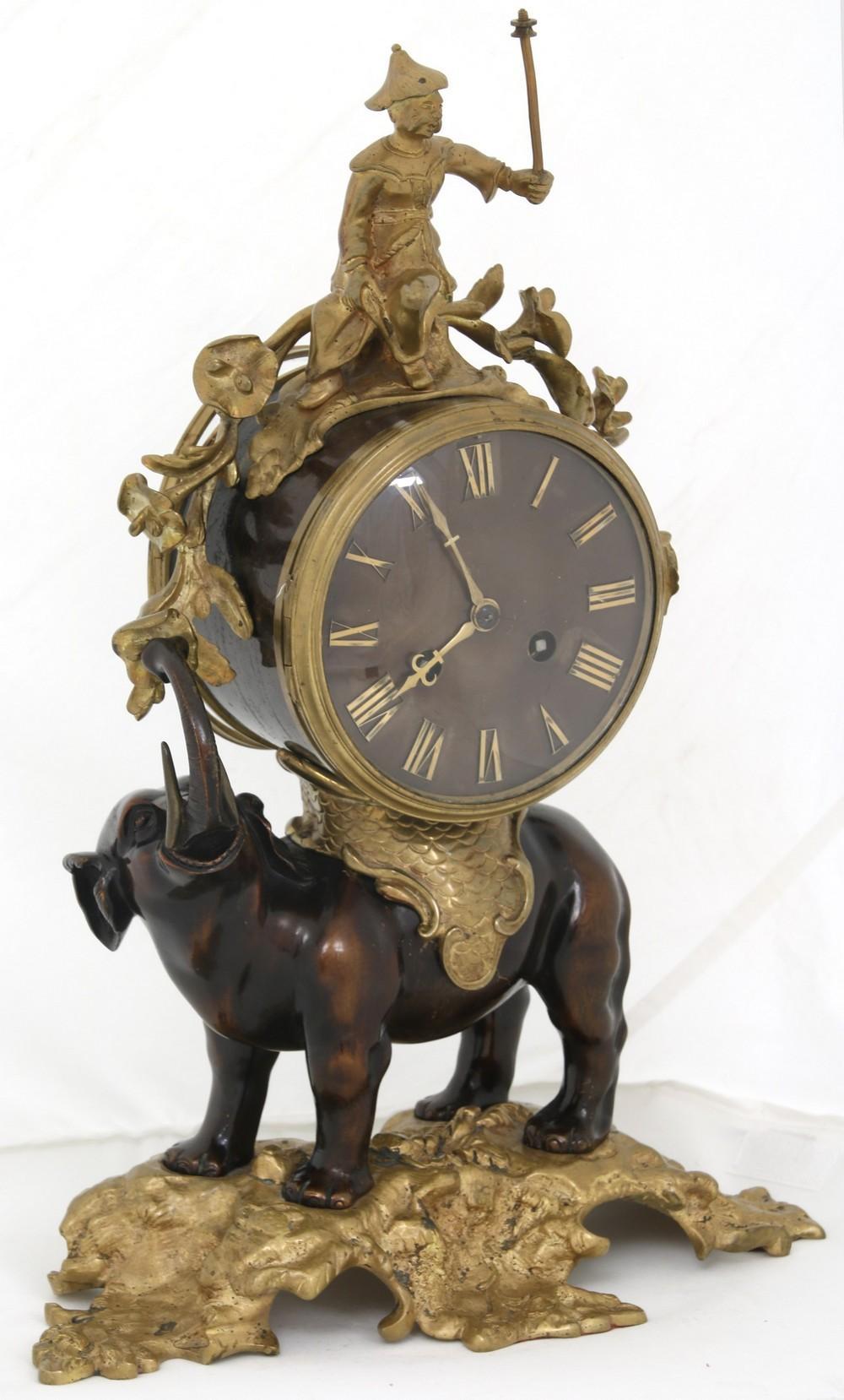French 19th century elephant form chinoiserie motif Patinated and gilt bronze mantel clock.
