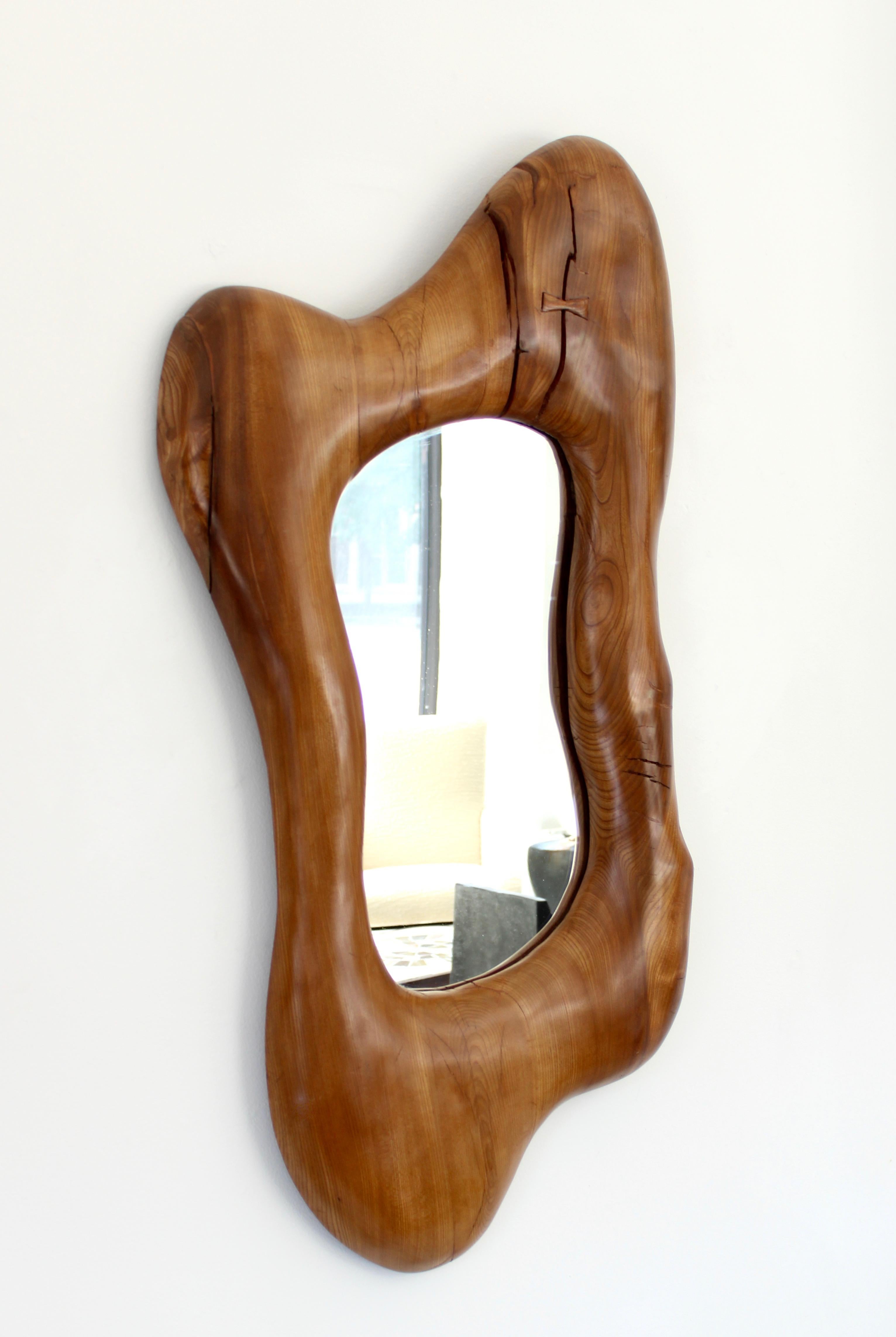 A contemporary organic modern large wall mirror in French elmwood with a butterfly closure in the spirit of Alexandre Noll and Nakashima.
Overall size: 24