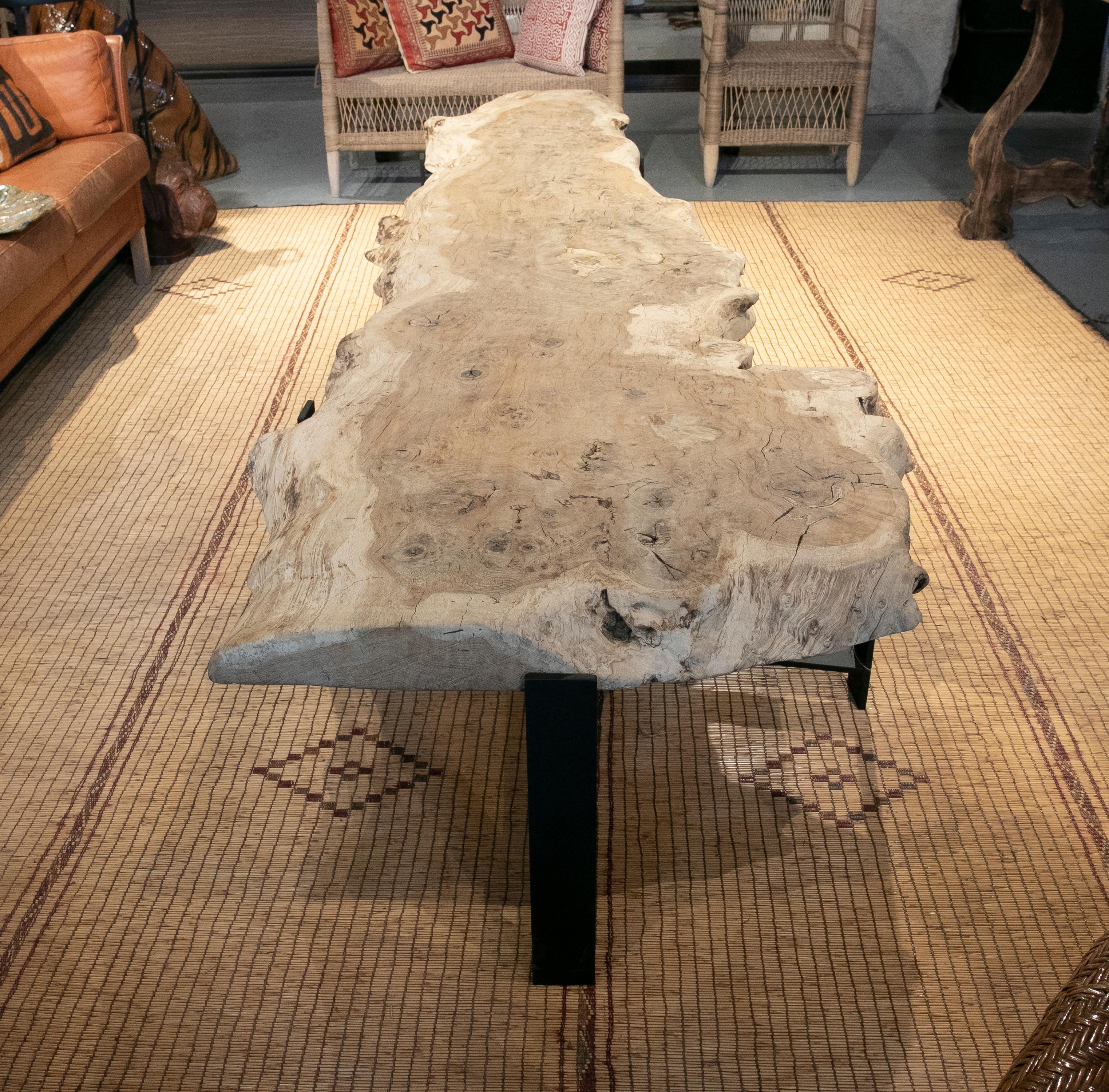 French elongated coffee table with antique oak top and iron base.