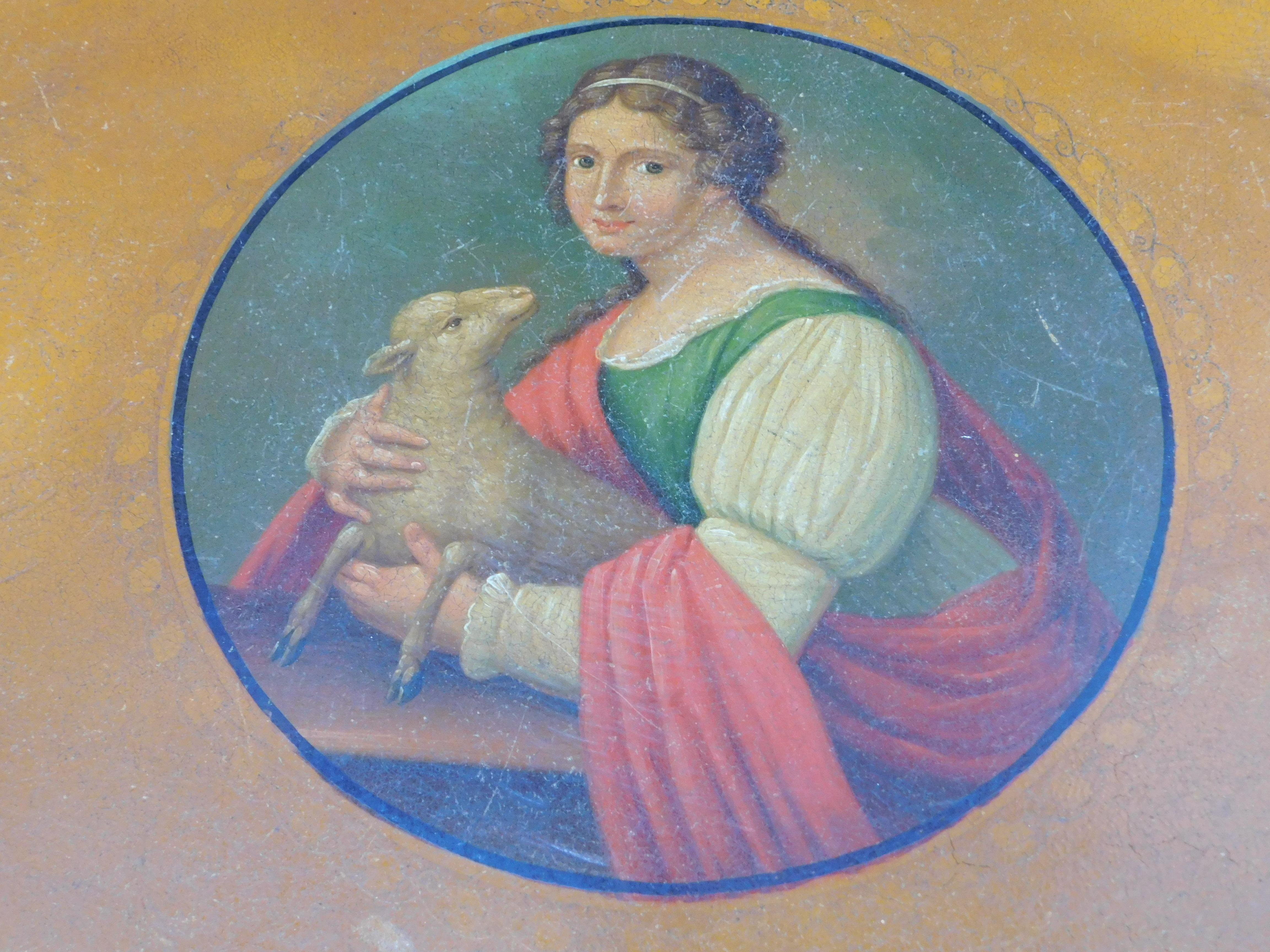 Early 19th century French tole tray in remarkably good condition. The tray itself is a deep golden yellow with delicately painted gold leaf border and a Fine central painting portrait of a beautiful young woman with a lamb.(symbolising purity)