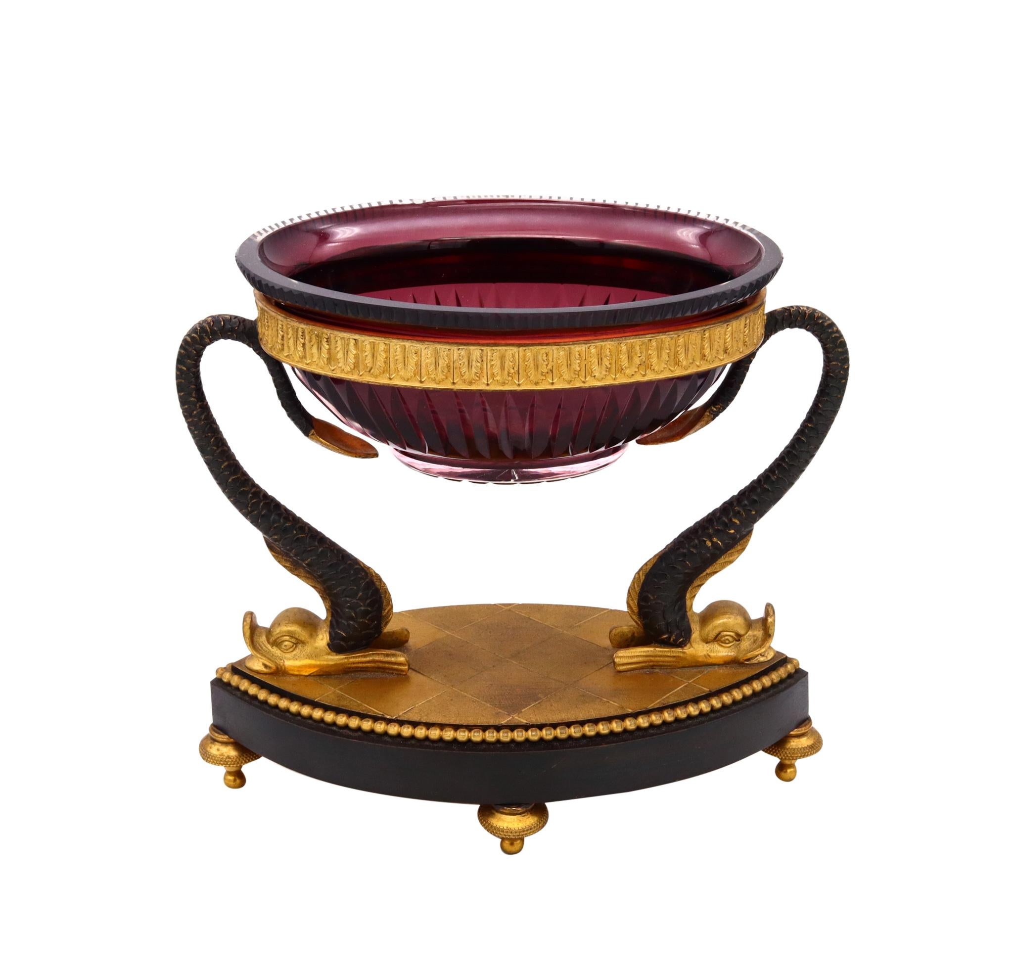 French Ormolu compote with Baccarat cut crystal.

Beautiful and fantastic presentation table compote, created with mythological allegoric patterns in France, during the early period of the 3rd French Empire, Napoleon III (1852-1870), circa 1860.