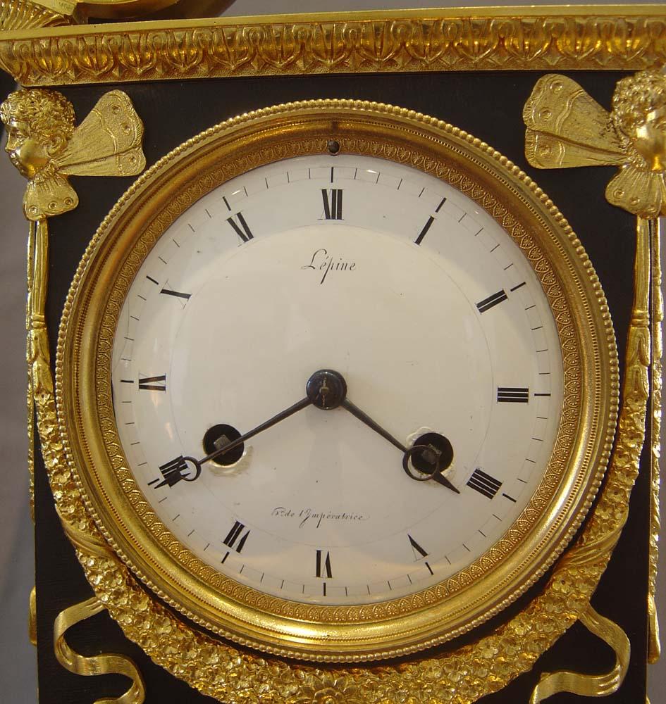 Patinated French Empire antique Apollo clock by Lepine and Rabiat. For Sale