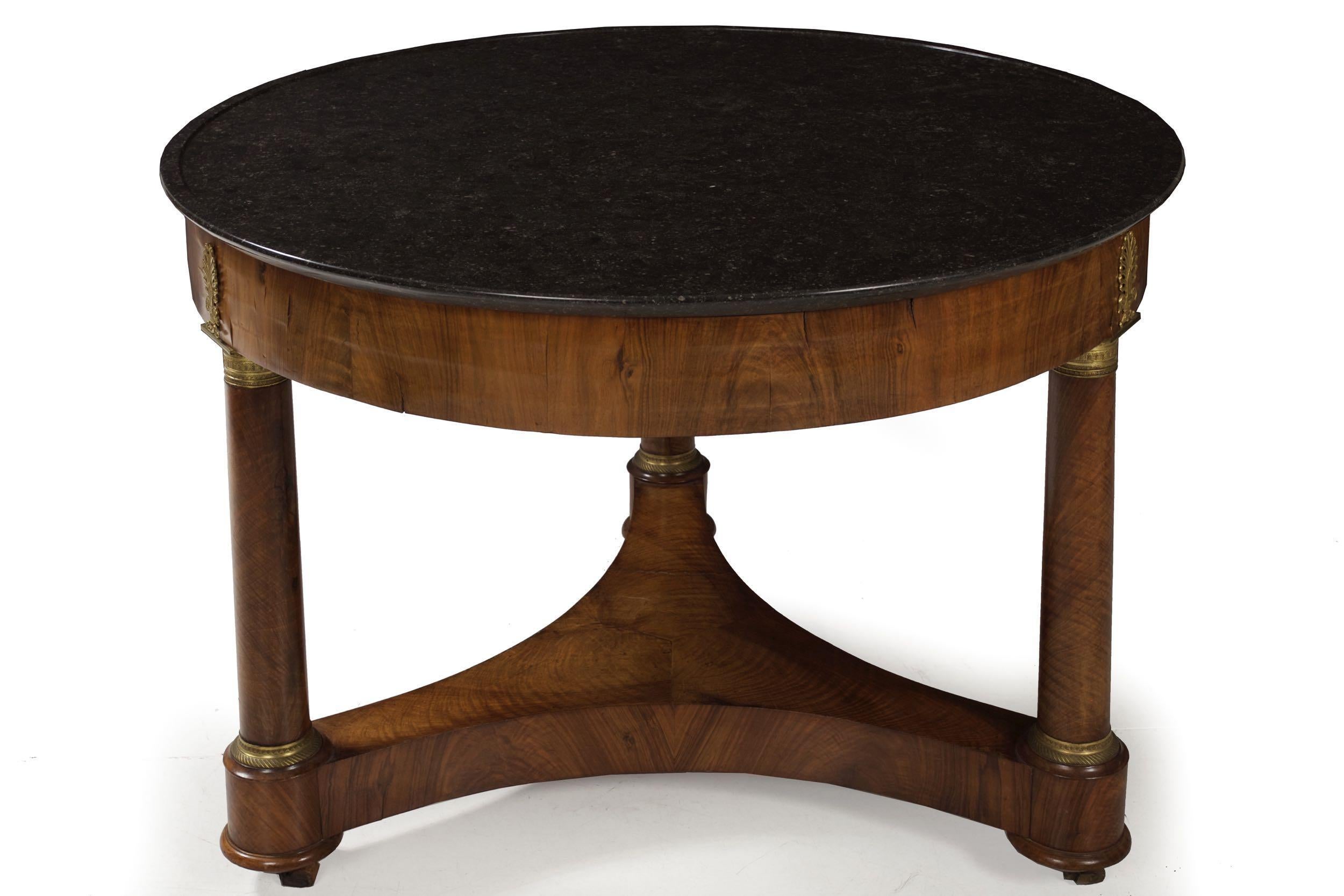 EMPIRE ORMOLU-MOUNTED BURL WALNUT CENTER TABLE
With an original dished black marble top; France, circa 1815
Item # 101OPB21A 

A very fine Empire center table crafted of beautifully patinated burl walnut veneers over secondary woods, the table