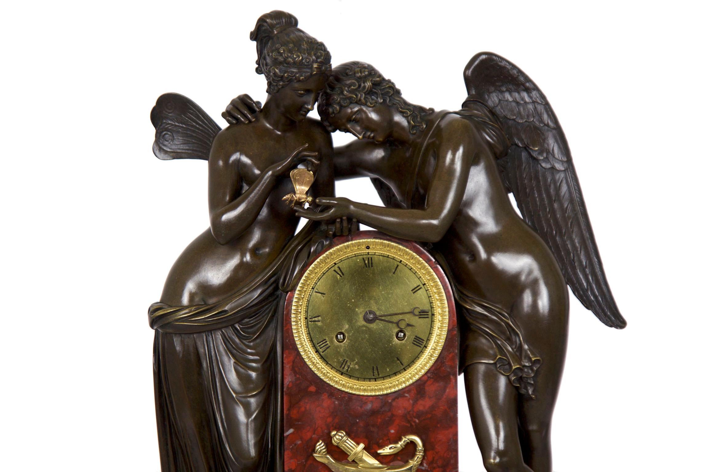 An exceptional Restauration period mantel clock with finely chiseled elements throughout, this work captures Psyche placing a butterfly into the open palm of Cupid. Each figure is cast with incredible skill, this self evident in the difficult areas: