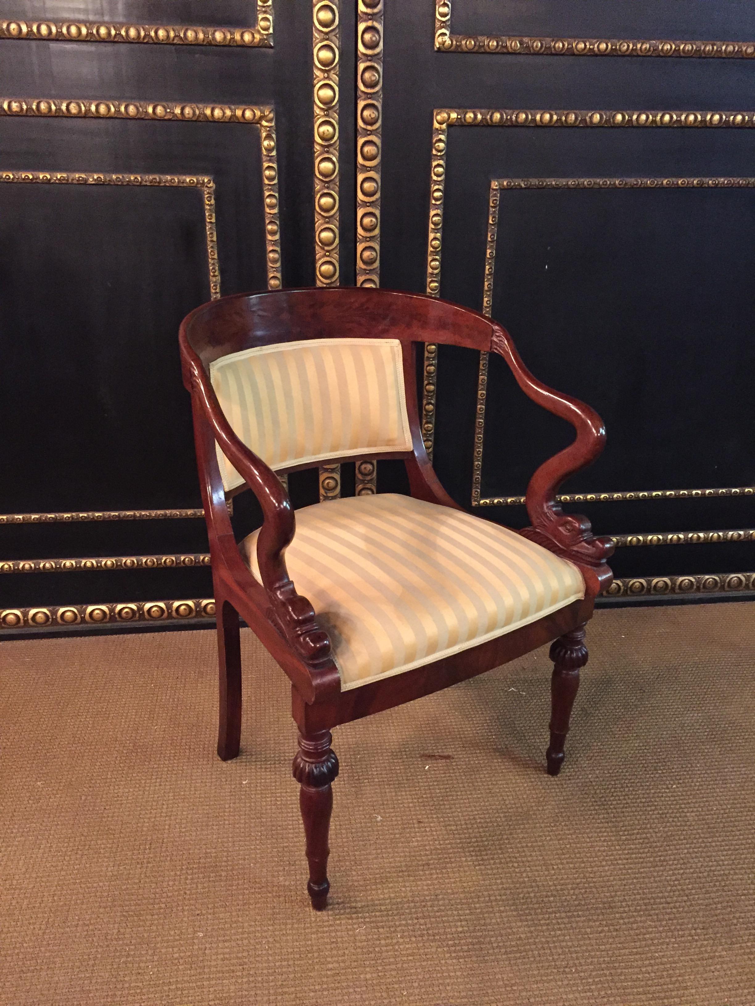 French Empire armchair, walnut, 1800-1810, shellac polish.
Armchair, massive mahogany, circa 1800-1810, restored condition, shellac polished, France,
Empire, new upholstery fabric.
The arms curved and carved with a mythological dolphin’s head at