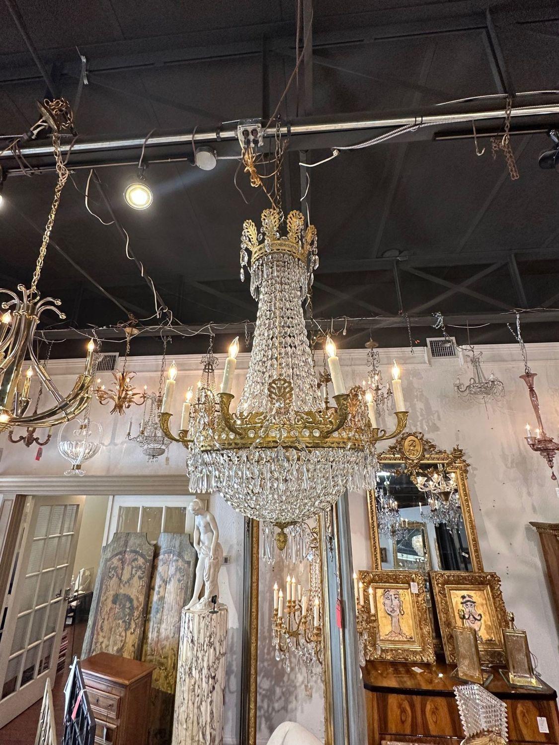 fine 19th century French Empire gilt and crystal basket form chandelier. circa 1870. The chandelier has been professionally rewired, comes with matching chain and canopy. It is ready to hang!