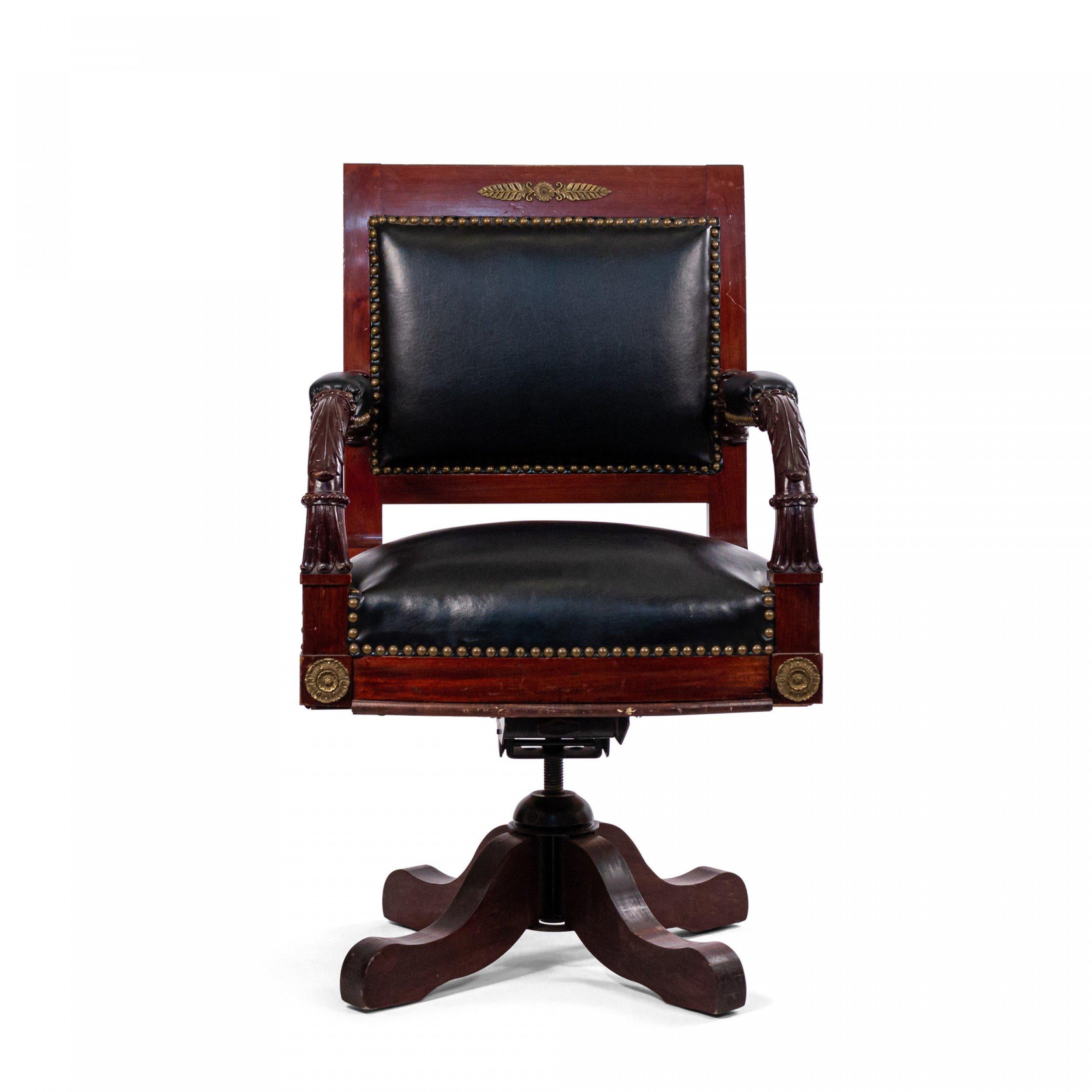 French Empire style (19th Century) ormolu mounted mahogany open swivel base arm chair with black leather seat and back.

Antique condition.