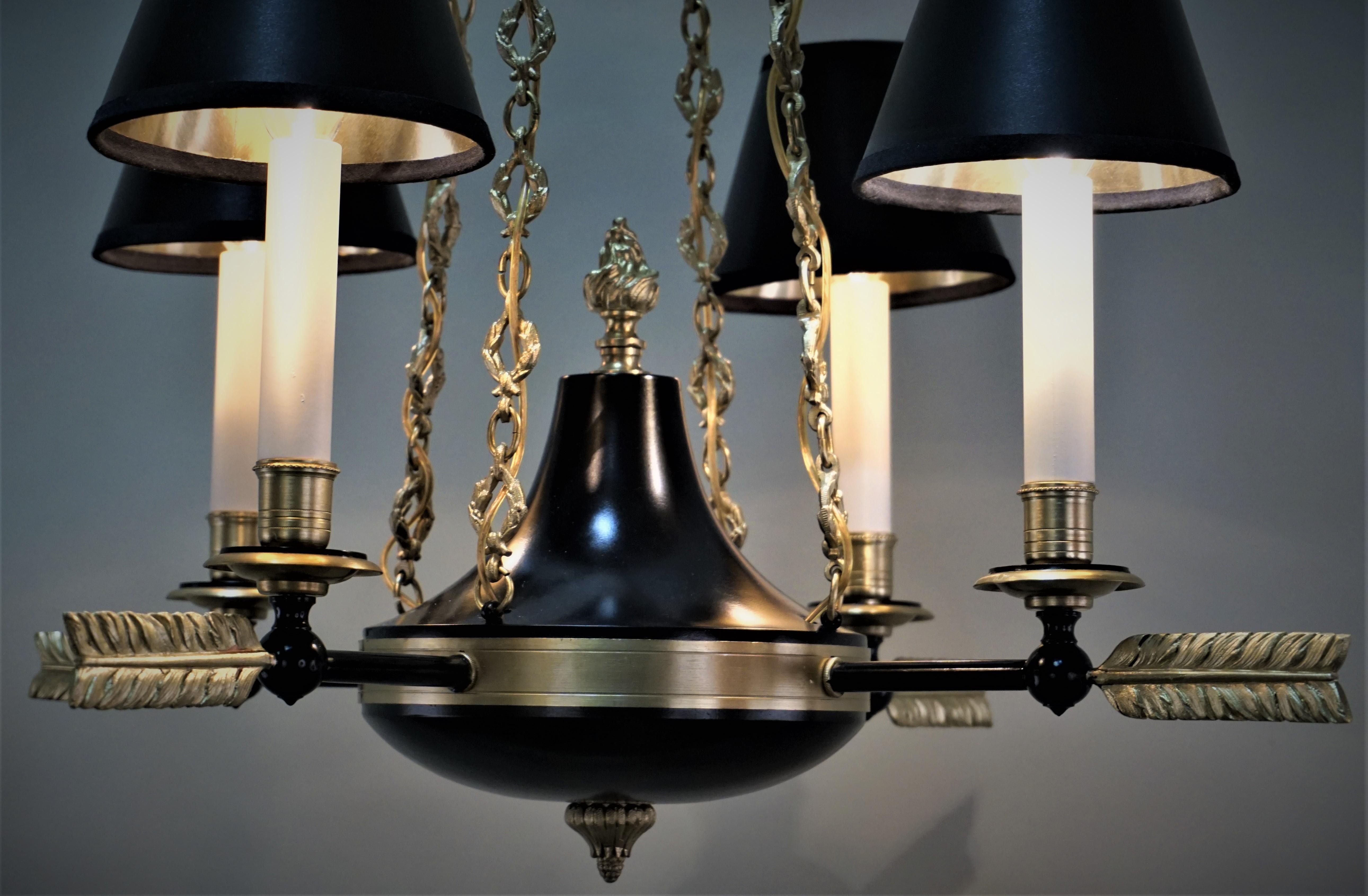 French Empire style four-light bronze and black lacquer finished chandelier.