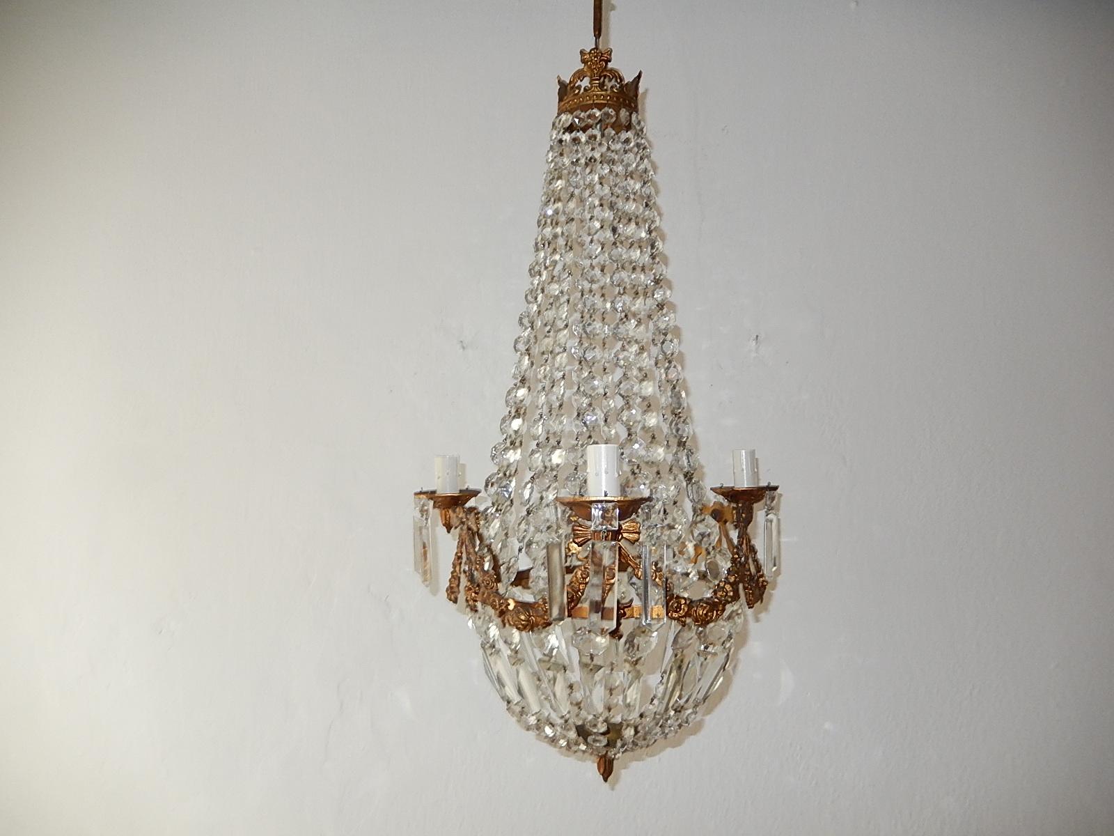 Housing three-lights. Rewired and ready to hang. Bronze flowers and bows detail. Crystal prisms. Adding original chain and canopy. Re-wired and ready to hang. Free priority shipping from Italy.