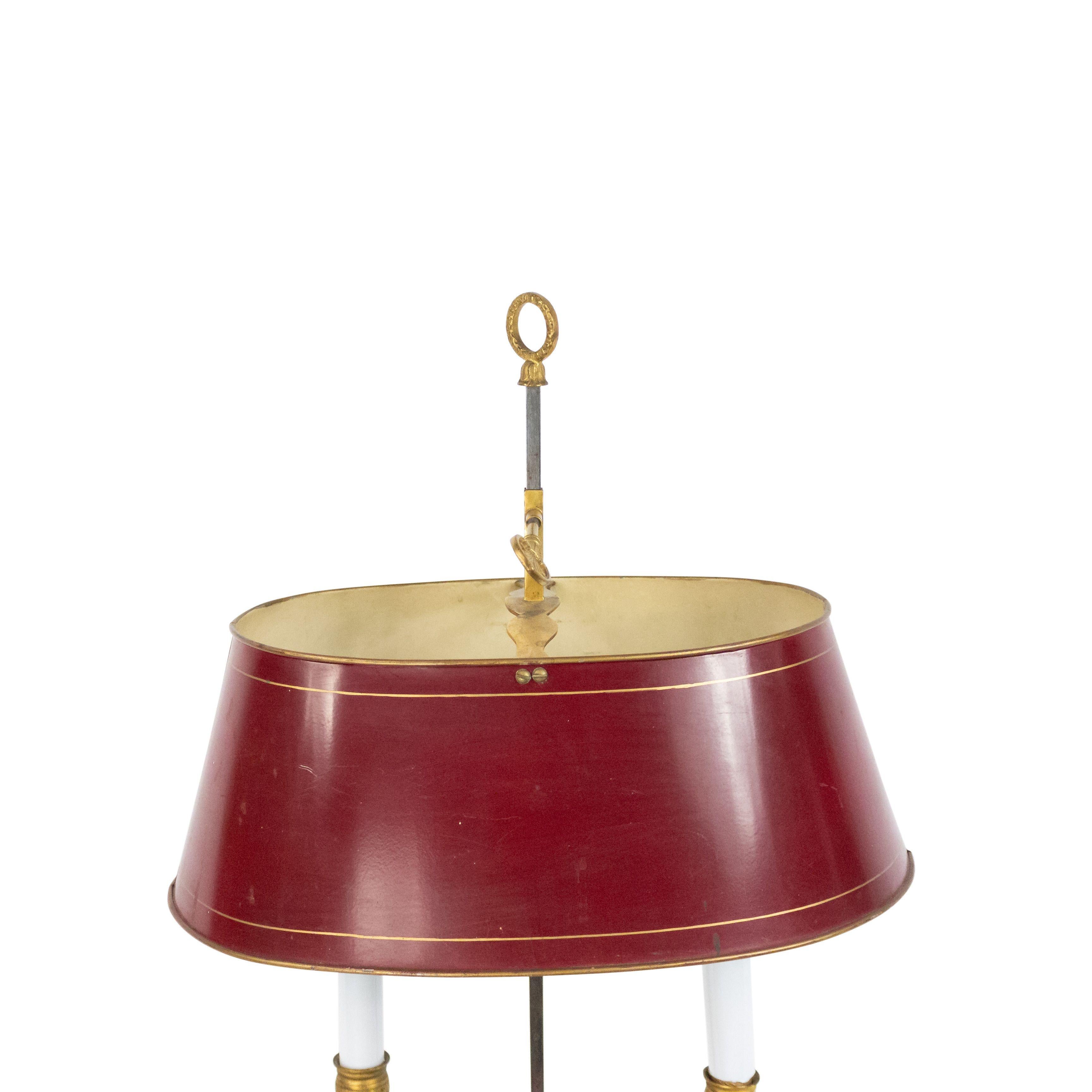 French Empire style bronze doré 2 arm bouillotte table lamp with swan form arms beneath a red tole adjustable shade 20th century.
