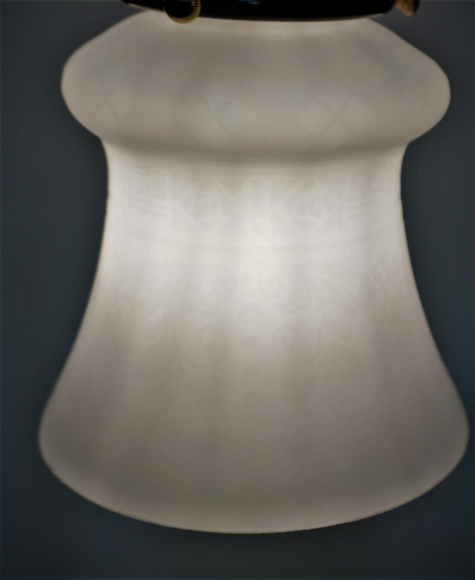 Elegant 2 tone color bronze desk or table lamp with etched glass shade.