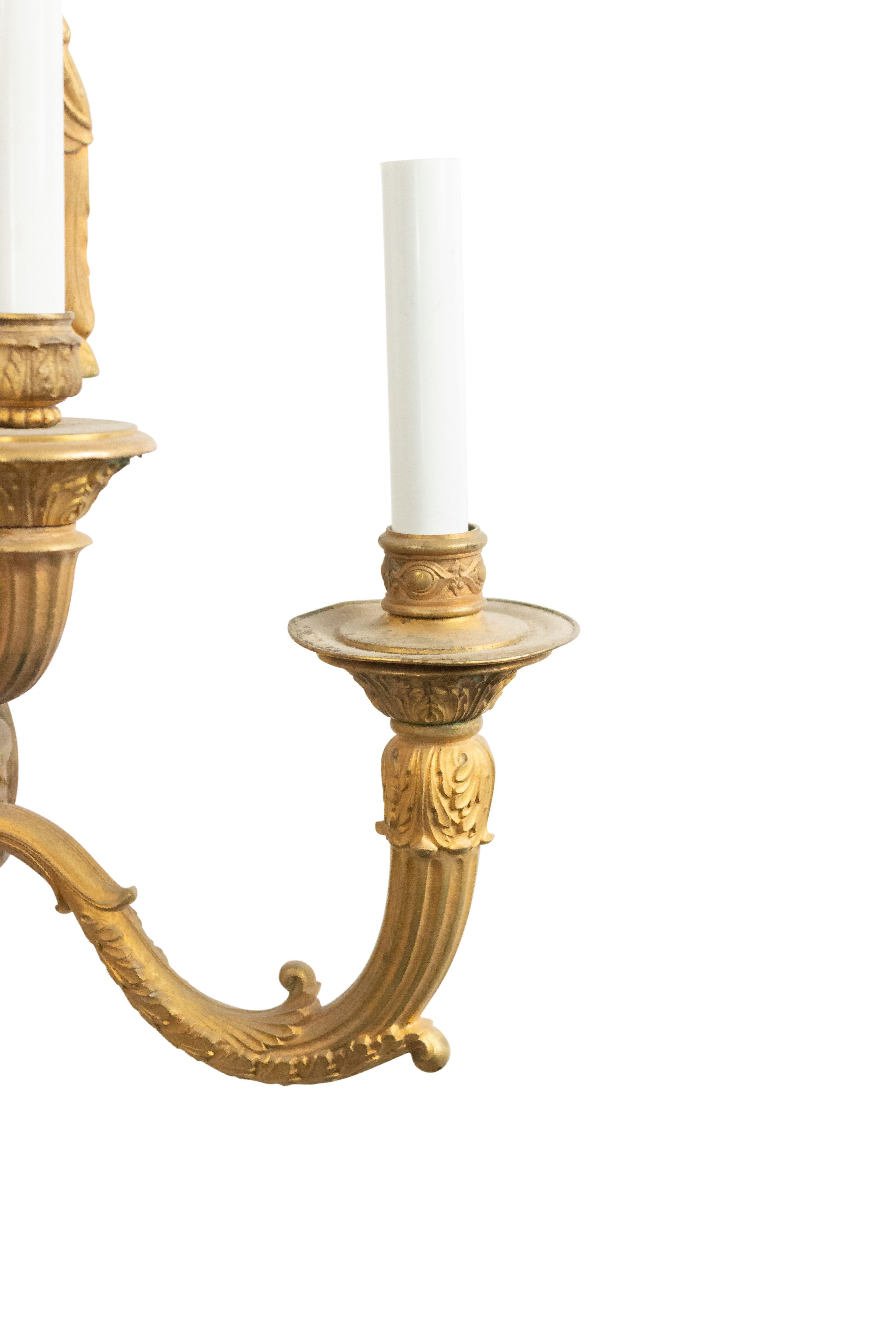 Pair of French Empire style bronze 5-arm wall sconces with swan top and double ball design (19th century).