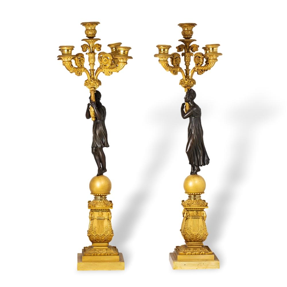 From our Sculpture collection, we are delighted to offer this fine pair of French Empire Candelabra. The Candelabra exceptionally cast as an opposing pair of Apollo and Daphne. The stepped plinth bases beautifully executed with Swan neck corners