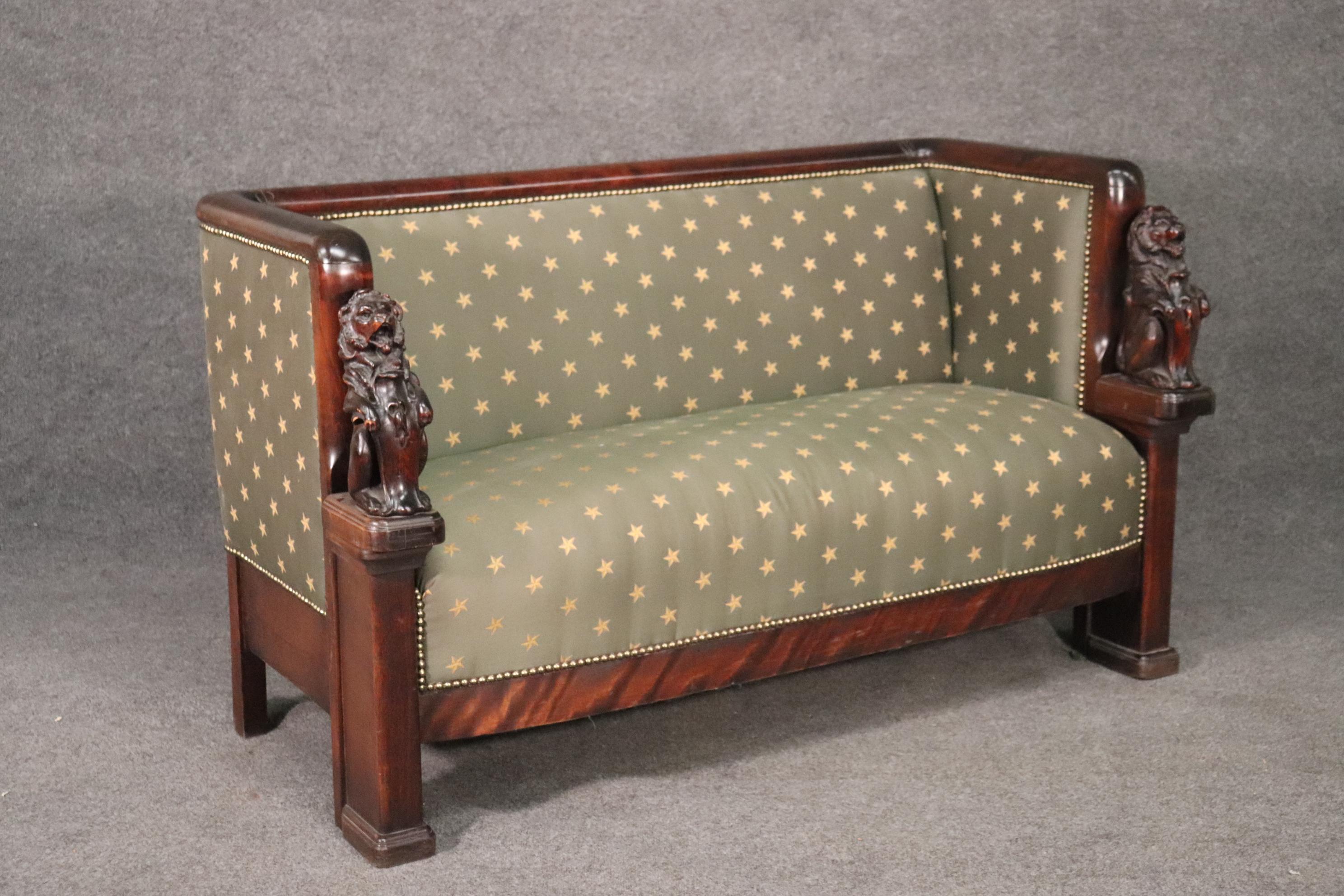 This is a gorgeous carved mahogany French sofa. The sofa has beautiful upholstery and the carving is exceptional. The sofa dates to the 1880s era and measures 60 wide x 31 deep x 34 tall and the seat height is 18 inches.