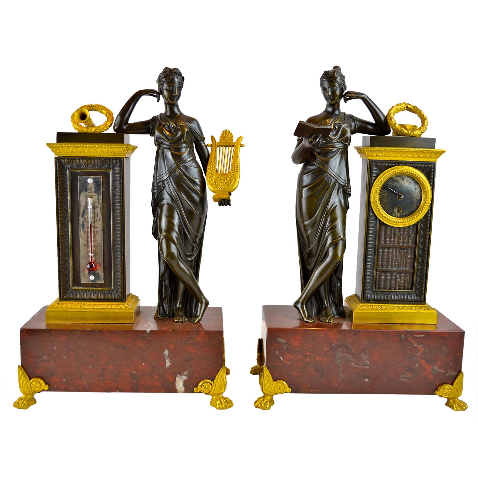 A rare pair of French Empire desk or table ornaments comprising a matching clock and barometer. Each features a classical maiden in patinated bronze standing beside the clock or barometer plinth, one holding a book, the other holding a gilded lyre;