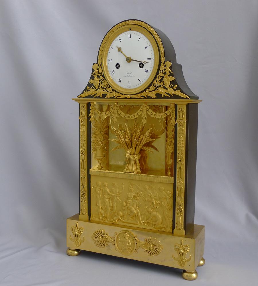 French Empire period ormolu and patinated bronze mantel clock representing Ceres. The crowning of Ceres is a stunning clock of very fine quality and with totally original fire gilded ormolu. The clock represents Ceres, the Roman goddess of corn and