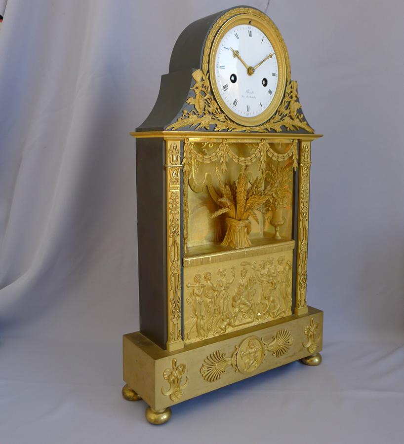 French Empire Clock in Ormolu and Patinated Bronze Signed Revel Rue De Richelieu In Good Condition For Sale In London, GB