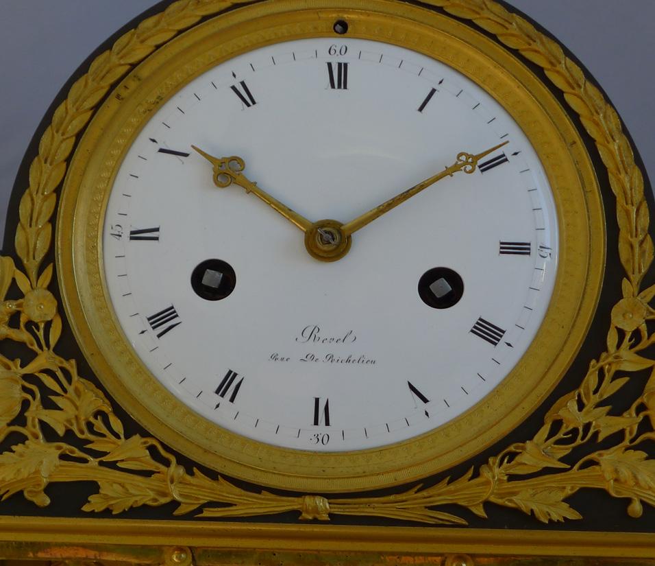 Early 19th Century French Empire Clock in Ormolu and Patinated Bronze Signed Revel Rue De Richelieu For Sale
