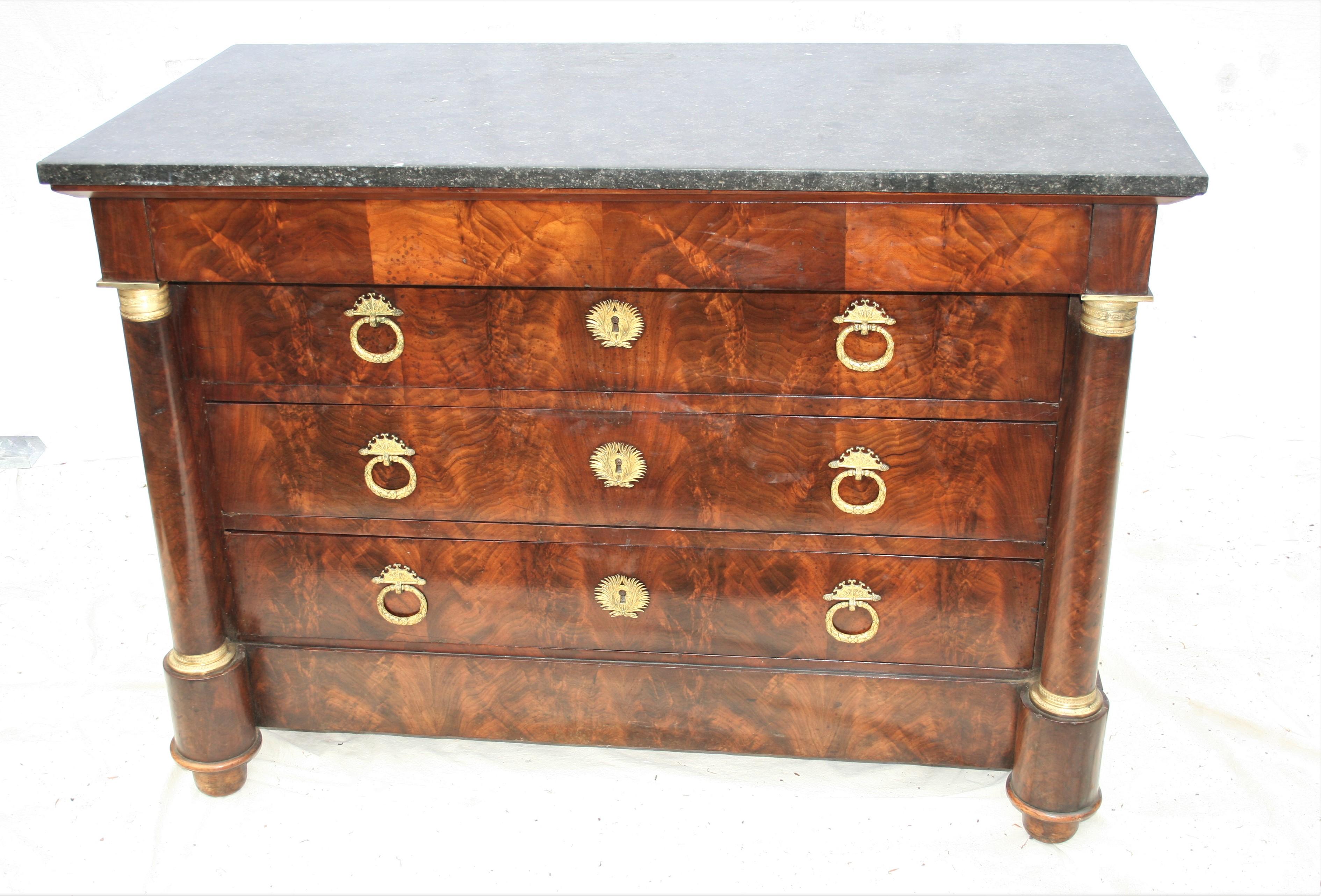 Period French mahogany commode with very good ormolu mounts and handles, solid oak carcass and original fossilized marble top , circa 1810.