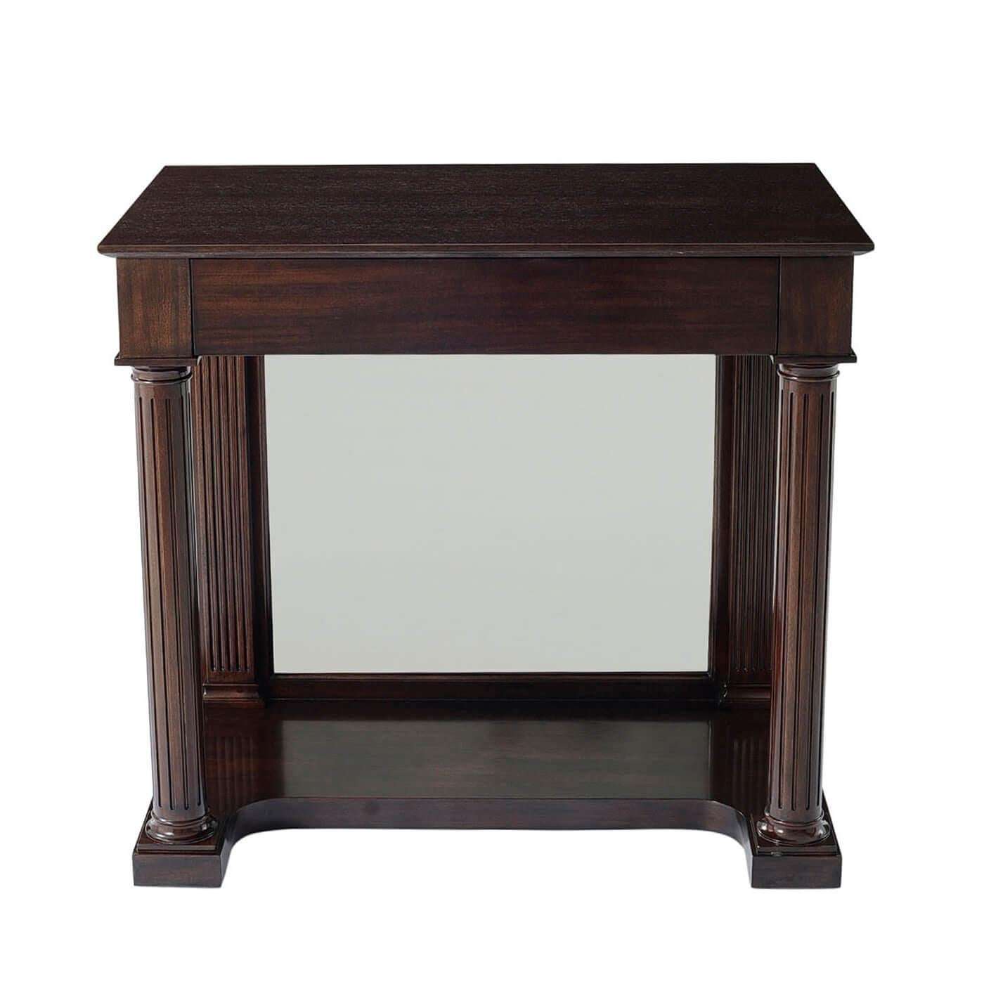 A French Empire style Neo Classic console table with strict lines, perfect symmetries, and secrets. A plain frieze apron holds a hidden drawer. The table base is a network of turned and fluted column supports and pilasters with a mirrored back