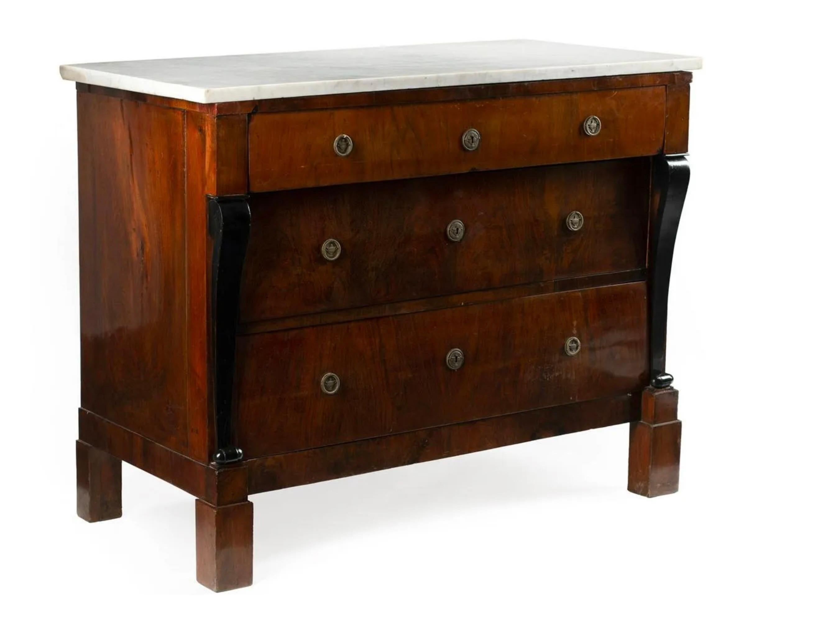Antique French Empire-Style Parcel Ebonized Mahogany Commode, marble top, three graduated drawers, tall block feet. Elegant French commode with ebonized detailing at curved pilasters flanking the bank of three drawers. Original pulls and white